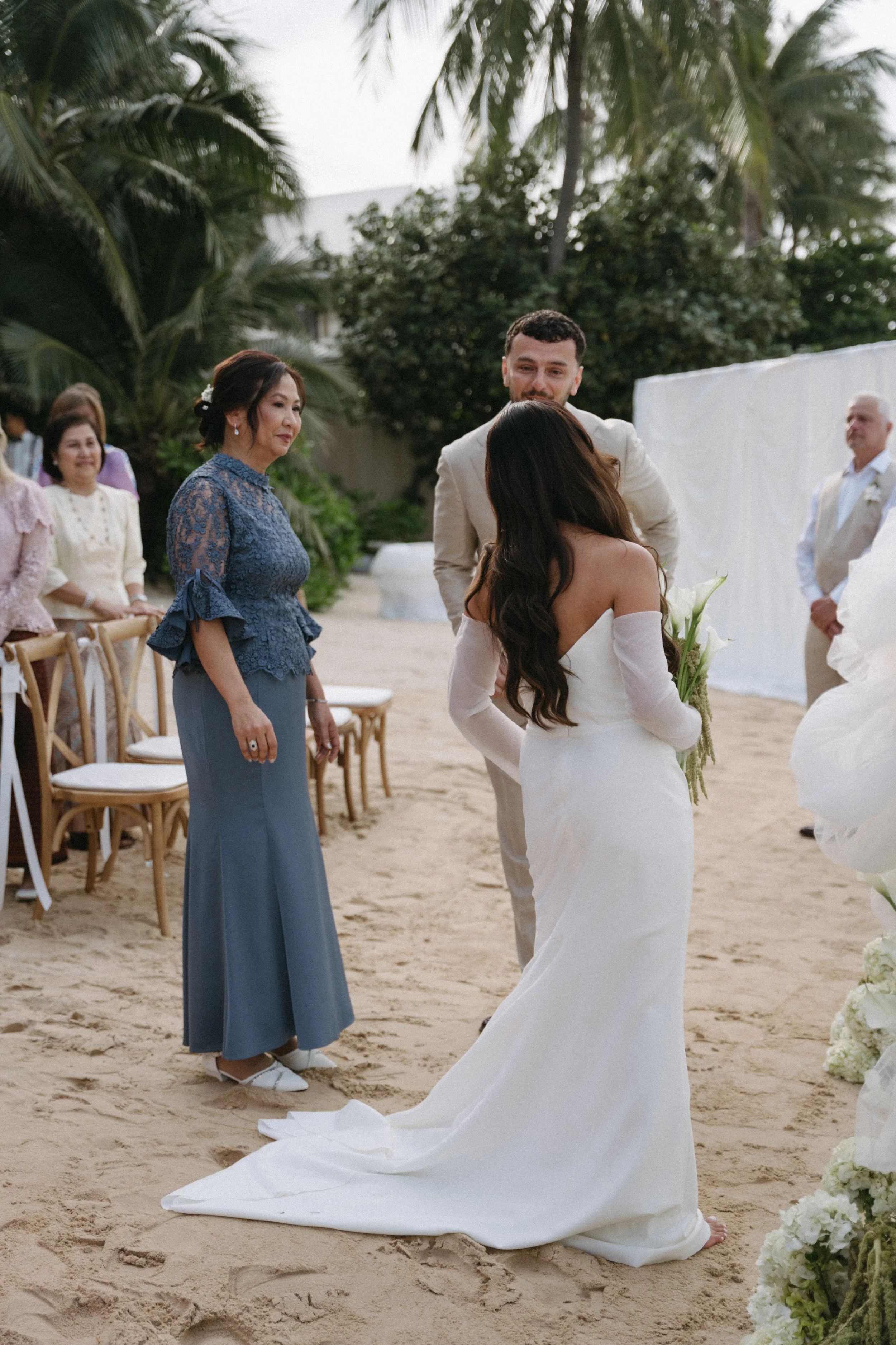 groom seeing bride for the first time at the end of the aisle