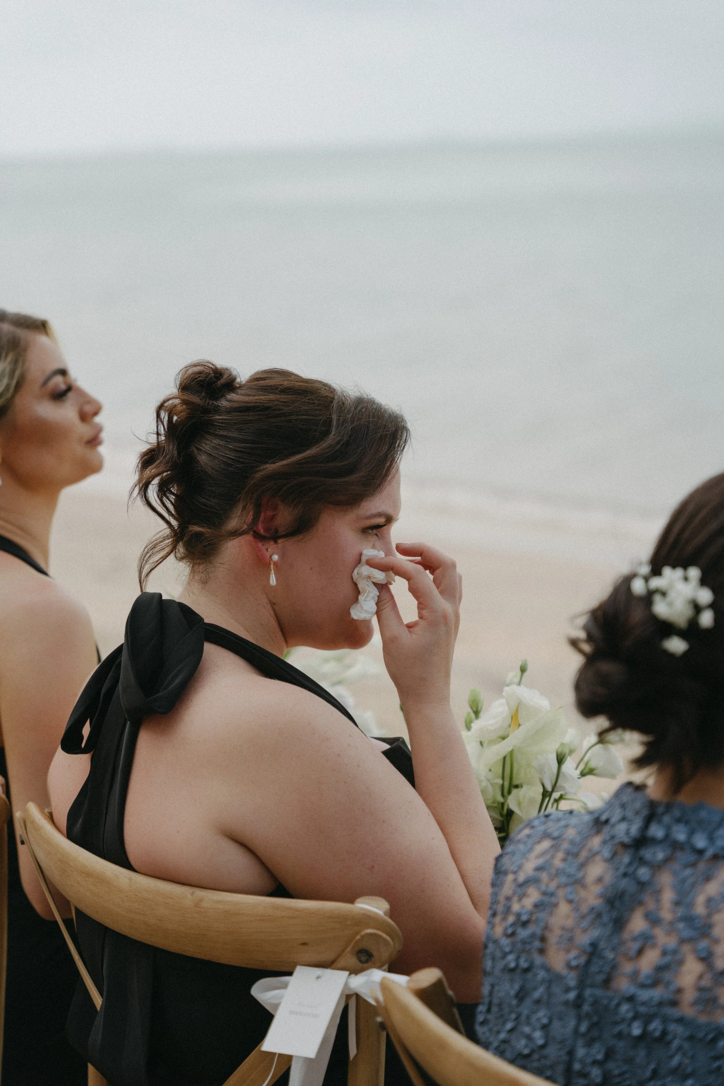 bridesmaid wiping away tears during koh samui destination wedding ceremony