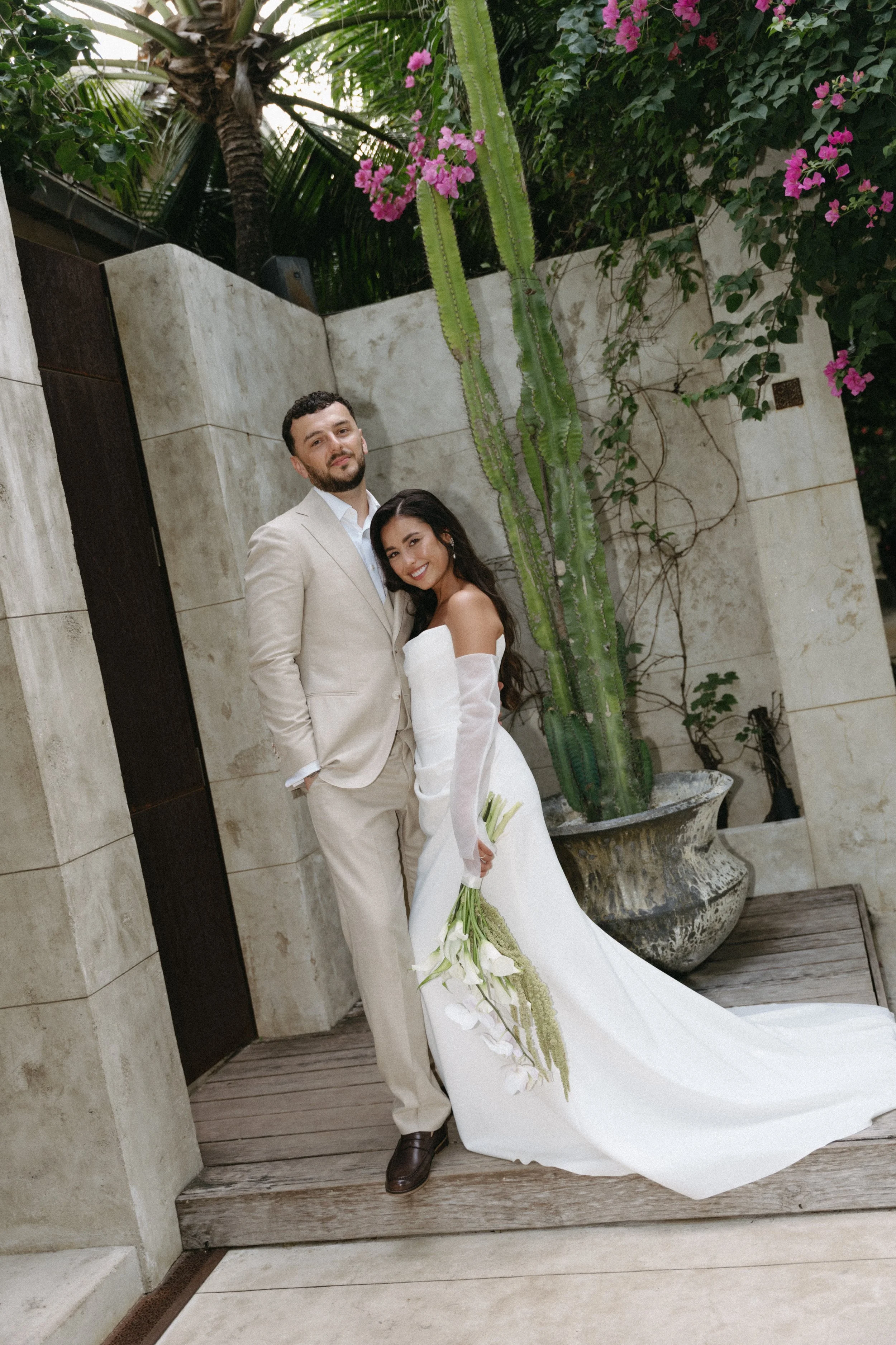 bride and groom posing outside wedding suite at odyssey mansion in koh samui