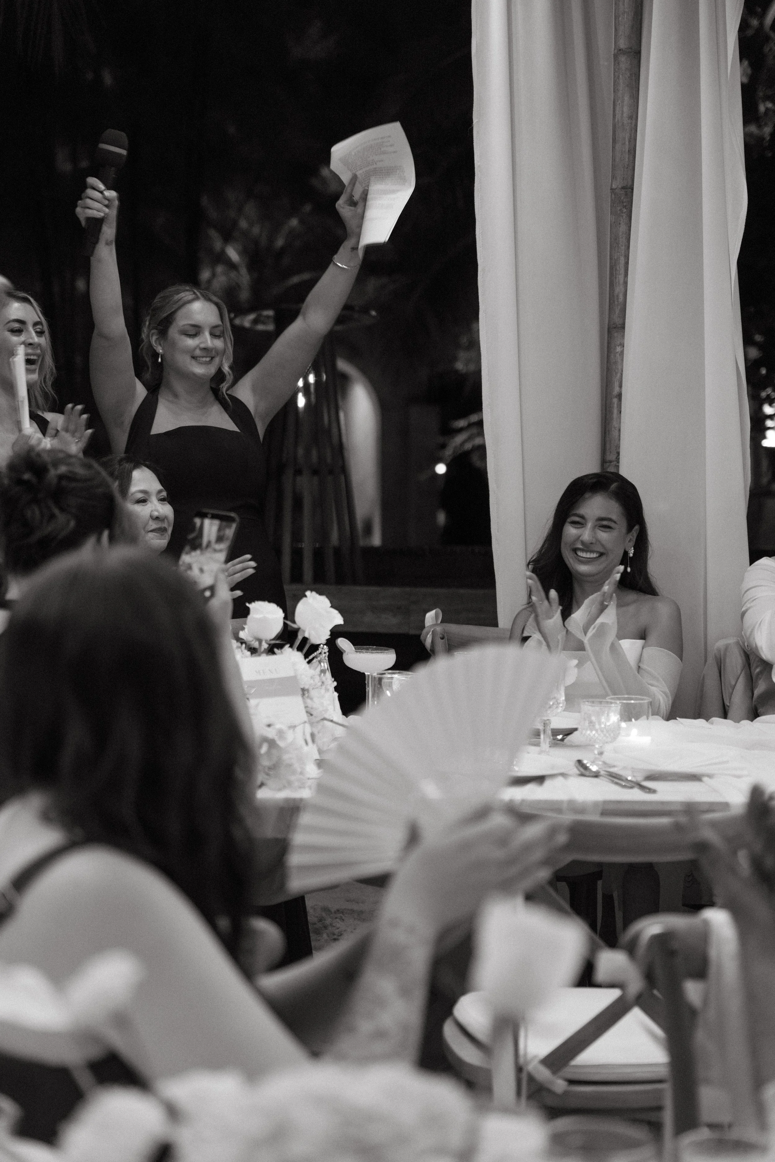 candid portrait of bridesmaid speech during an outdoor evening reception on Bangrak Beach, Koh Samui
