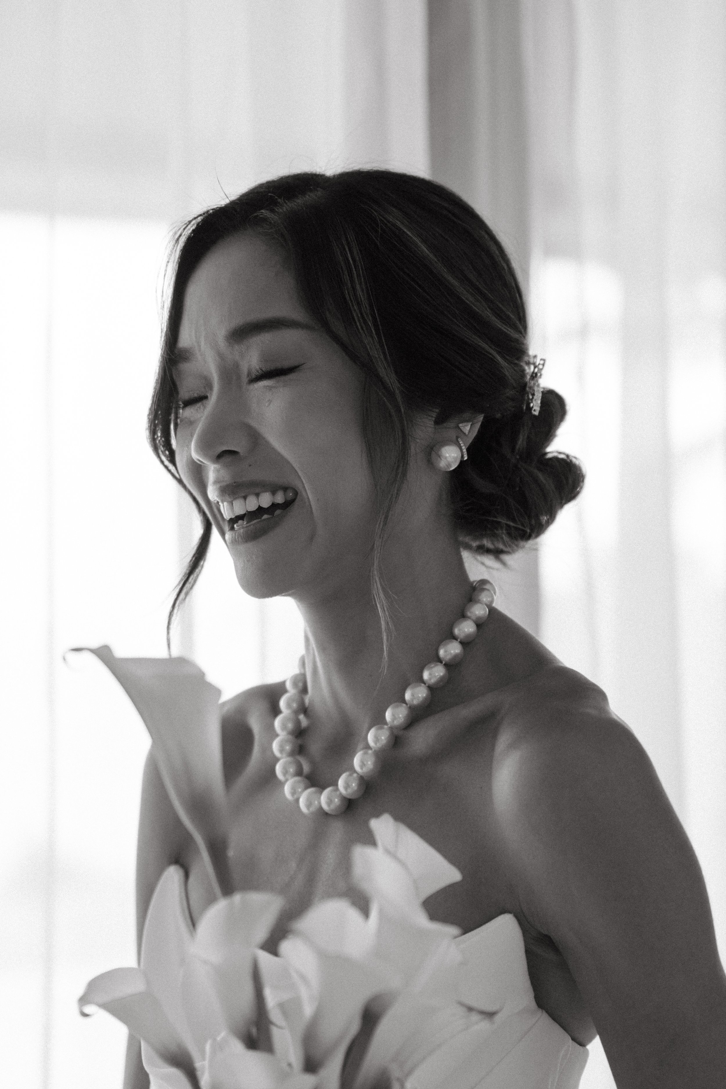 Bride laughing during private vow exchange at Phuket destination wedding