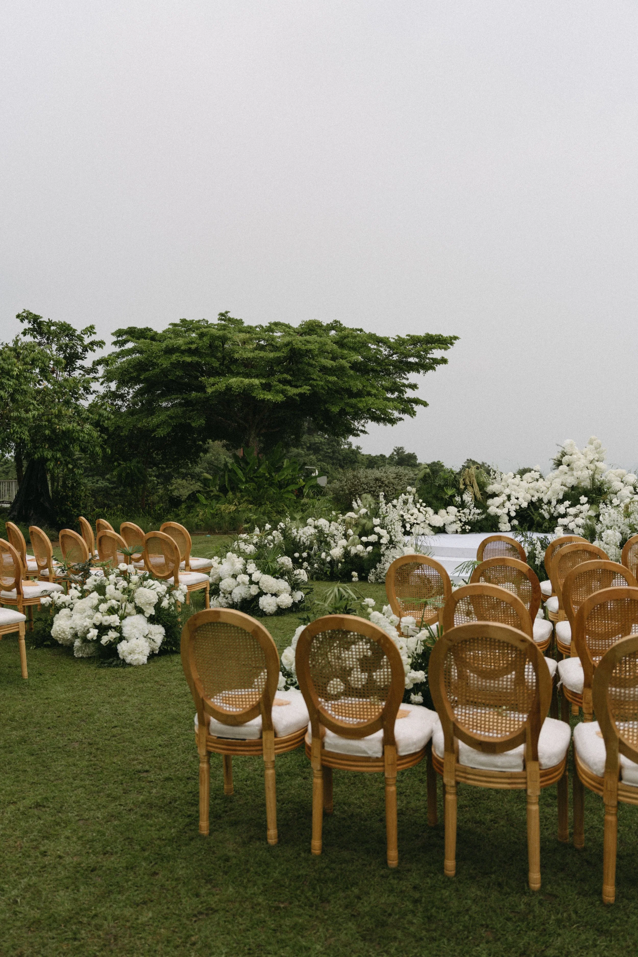 chairs lined up for phuket destination wedding ceremony at como point yamu