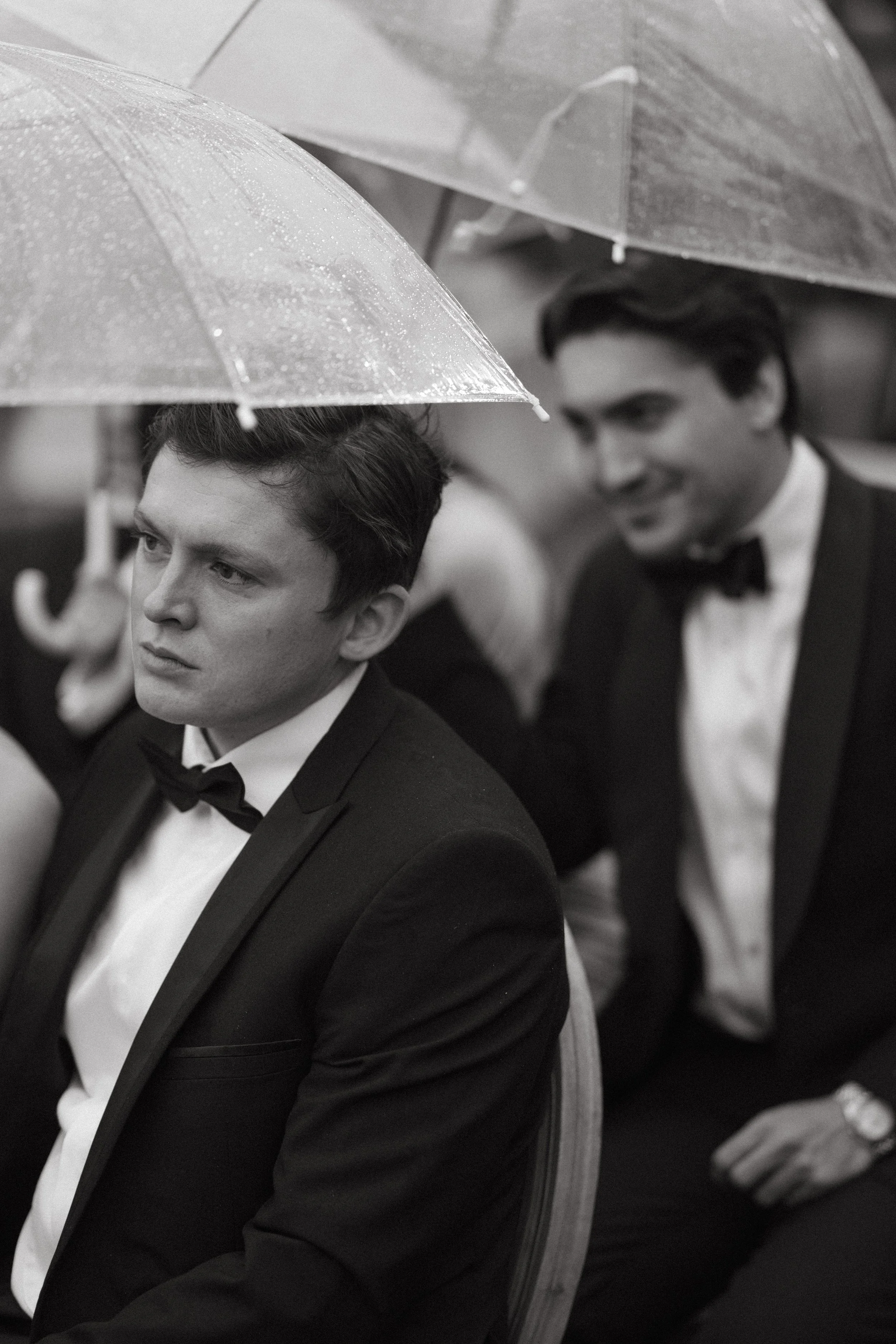 Wedding guests seated under umbrellas with ocean view at COMO Point Yamu ceremony