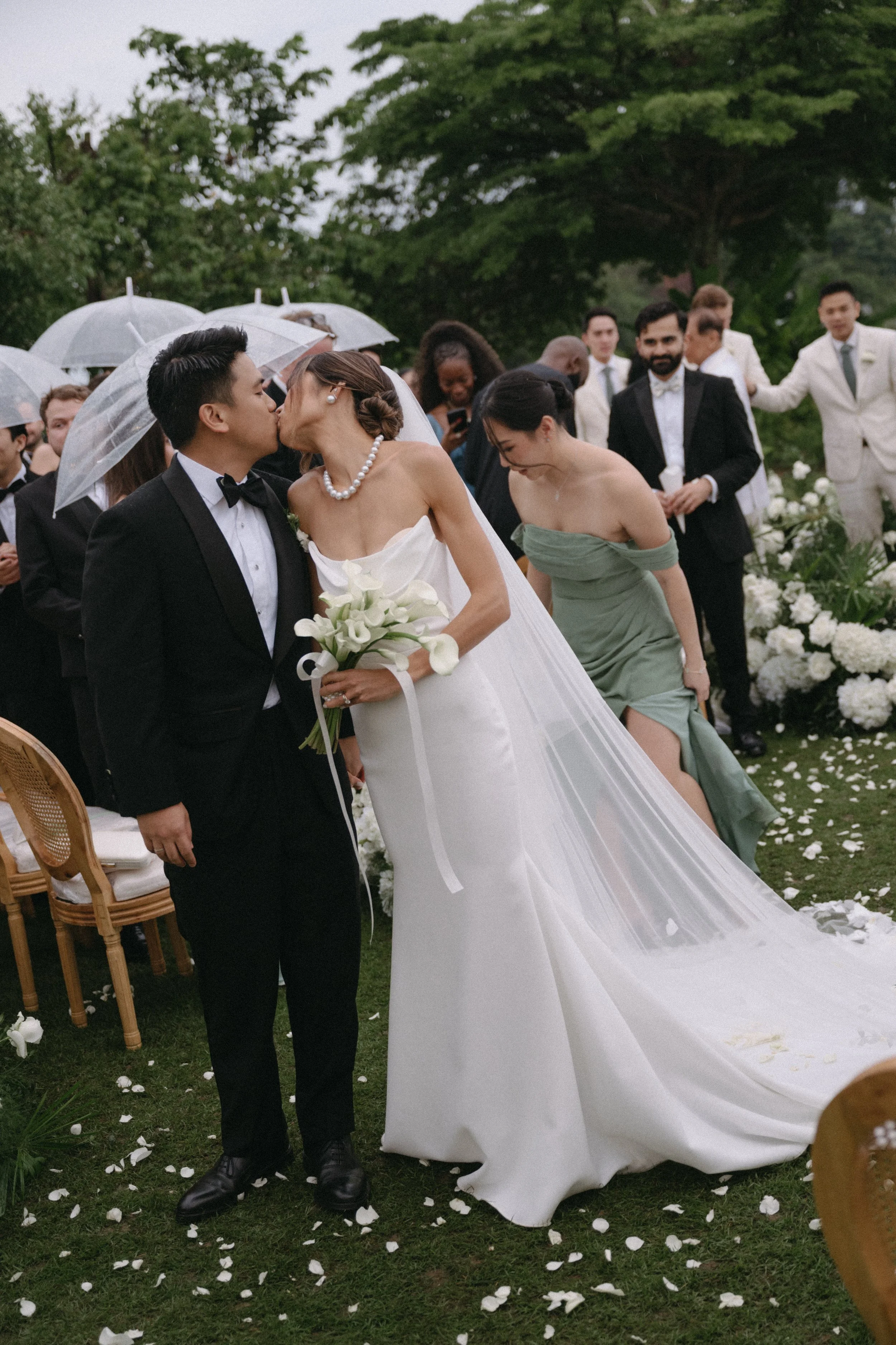 Bride and groom sharing first kiss as newlyweds at COMO Point Yamu