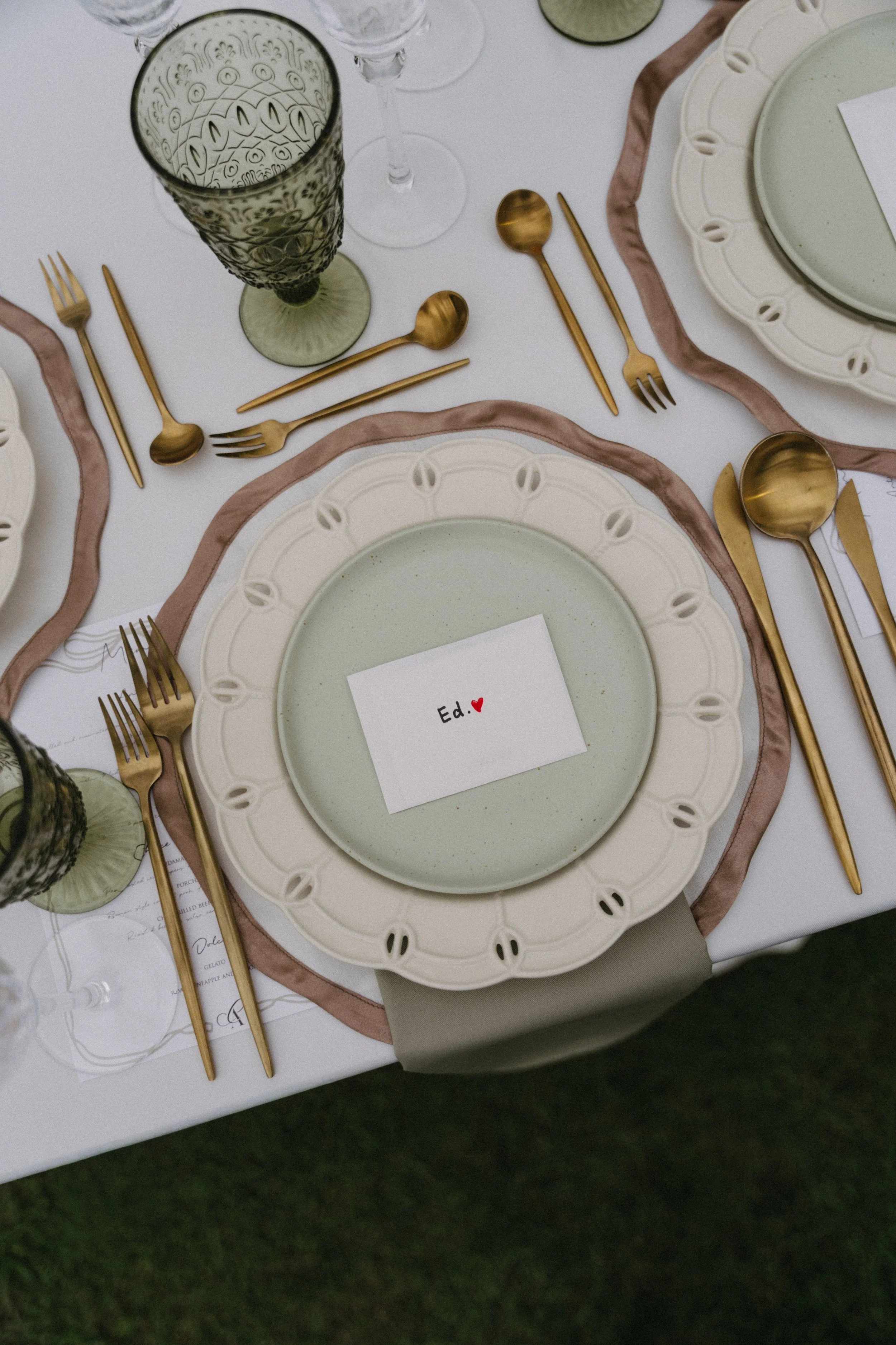  Sage green plate with gold cutlery and place card, reception table setting