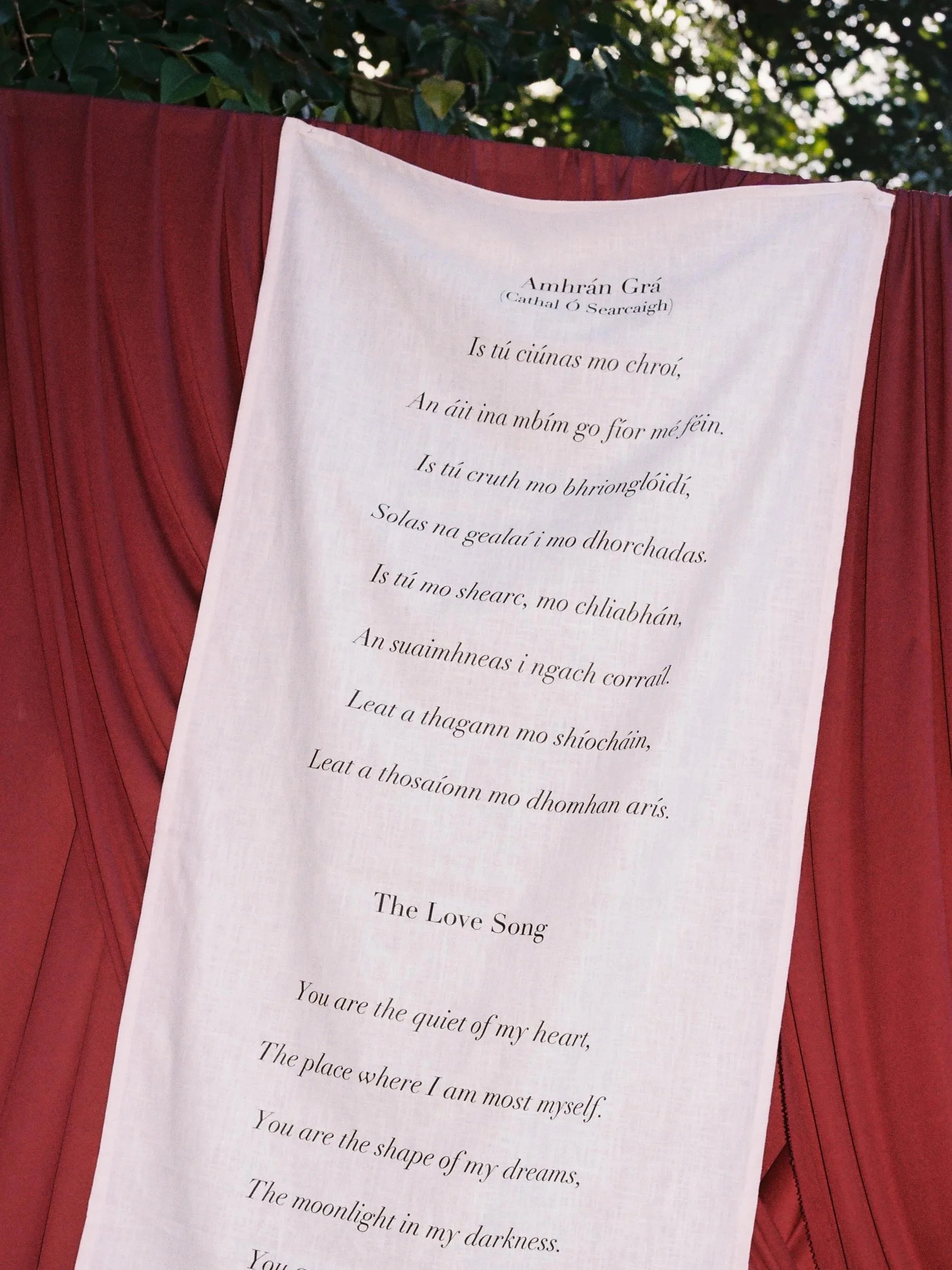 film photo of the love song printed on fabric at wedding reception
