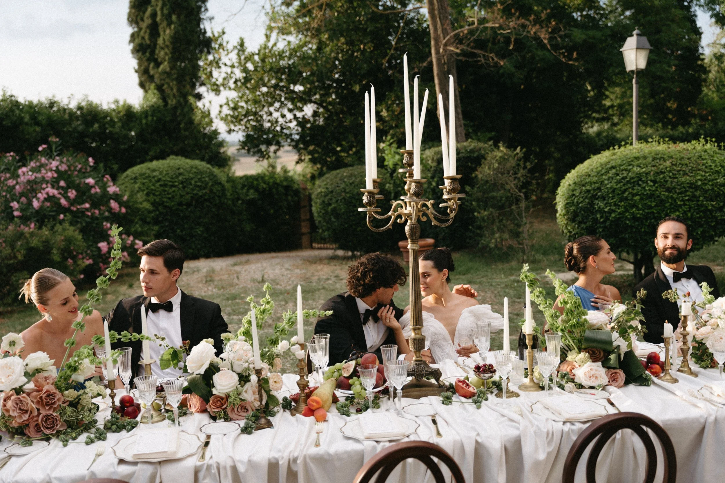 Bride, groom, and wedding party celebrating together at Villa Cozzano destination wedding