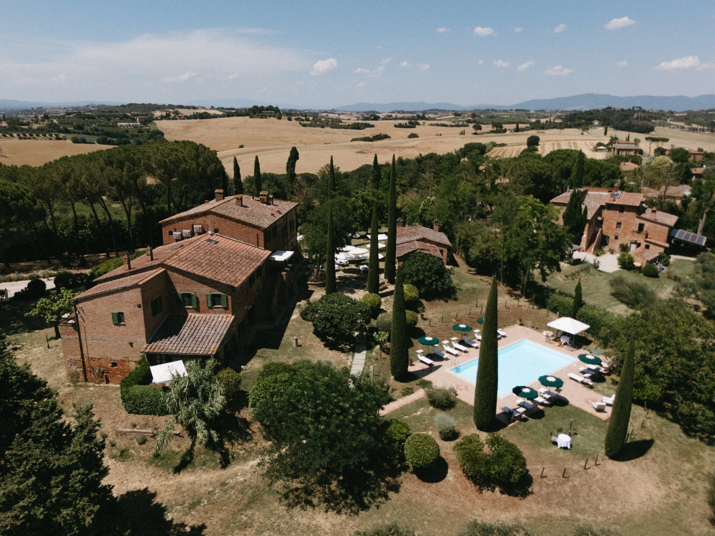 drone shot of villa cozzano wedding venue in tuscany