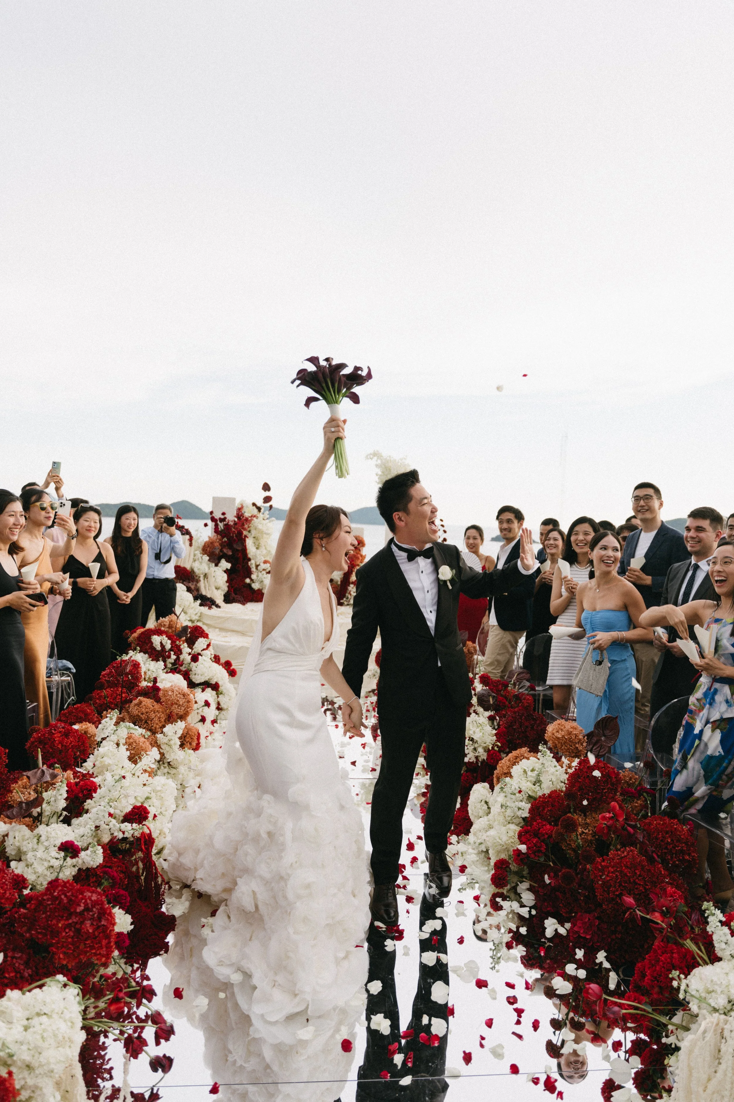 couple walking back down the aisle after wedding ceremony in phuket thailand