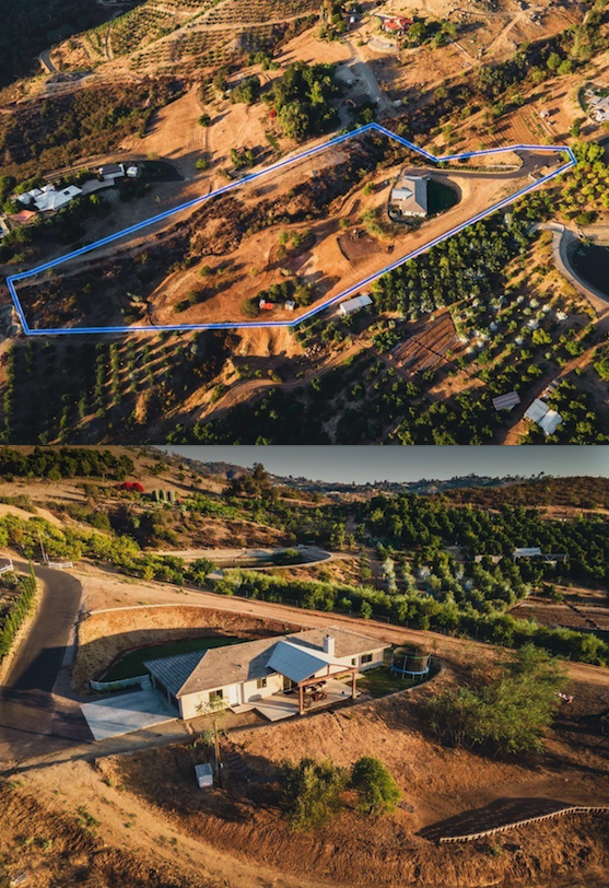 Aerial view of a hilly rural property with a house, surrounding farmland, and a marked boundary line in the upper section.