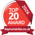 Red circular badge with white text displaying 'Top 20 Award 2026' and a URL 'daynurseries.co.uk' at the bottom.