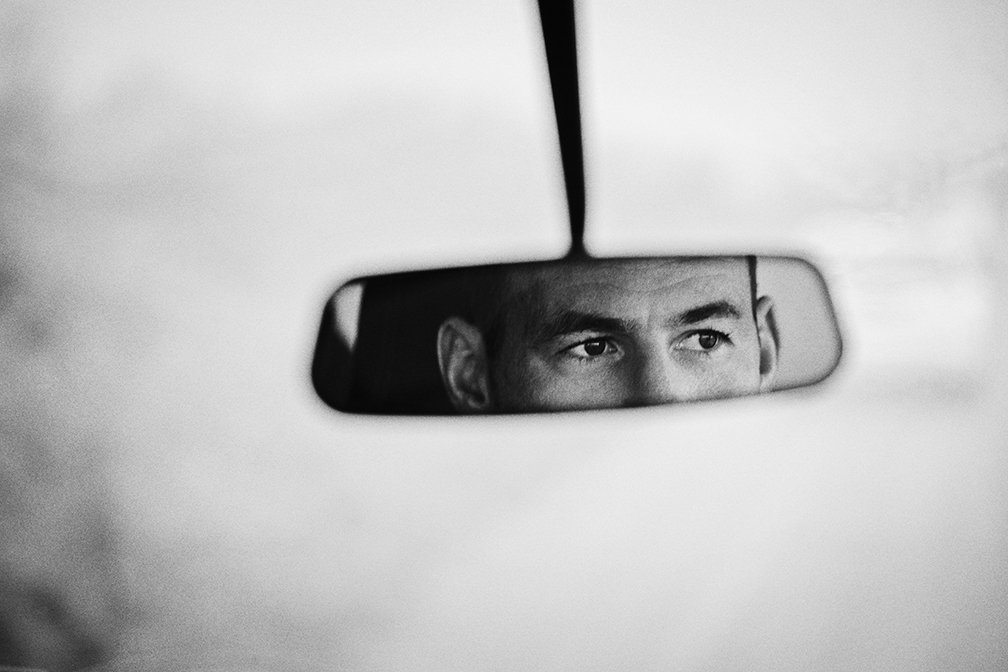 Mark Cavendish reflected in the rearview mirror of his Defender 110, shot near his home on the Isle of Man