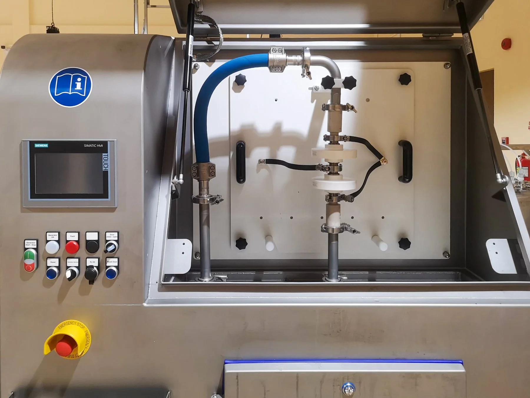 Industrial machine with control panel and pipes inside