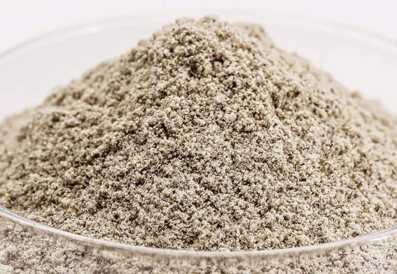 Close-up of yeast powder in a glass dish.