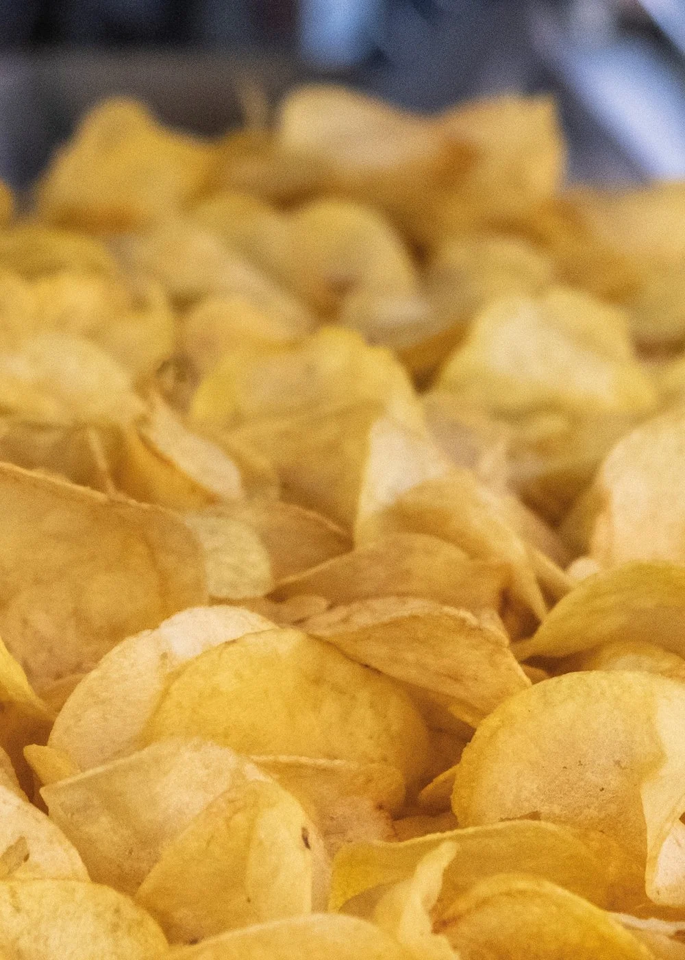 Close-up of potato chips in a pile.