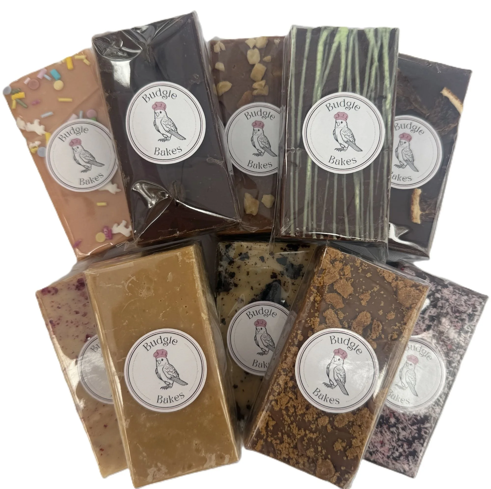 Assorted handmade Budgie Bakes fudge bars showcasing a range of flavours made with real ingredients and no artificial preservatives.