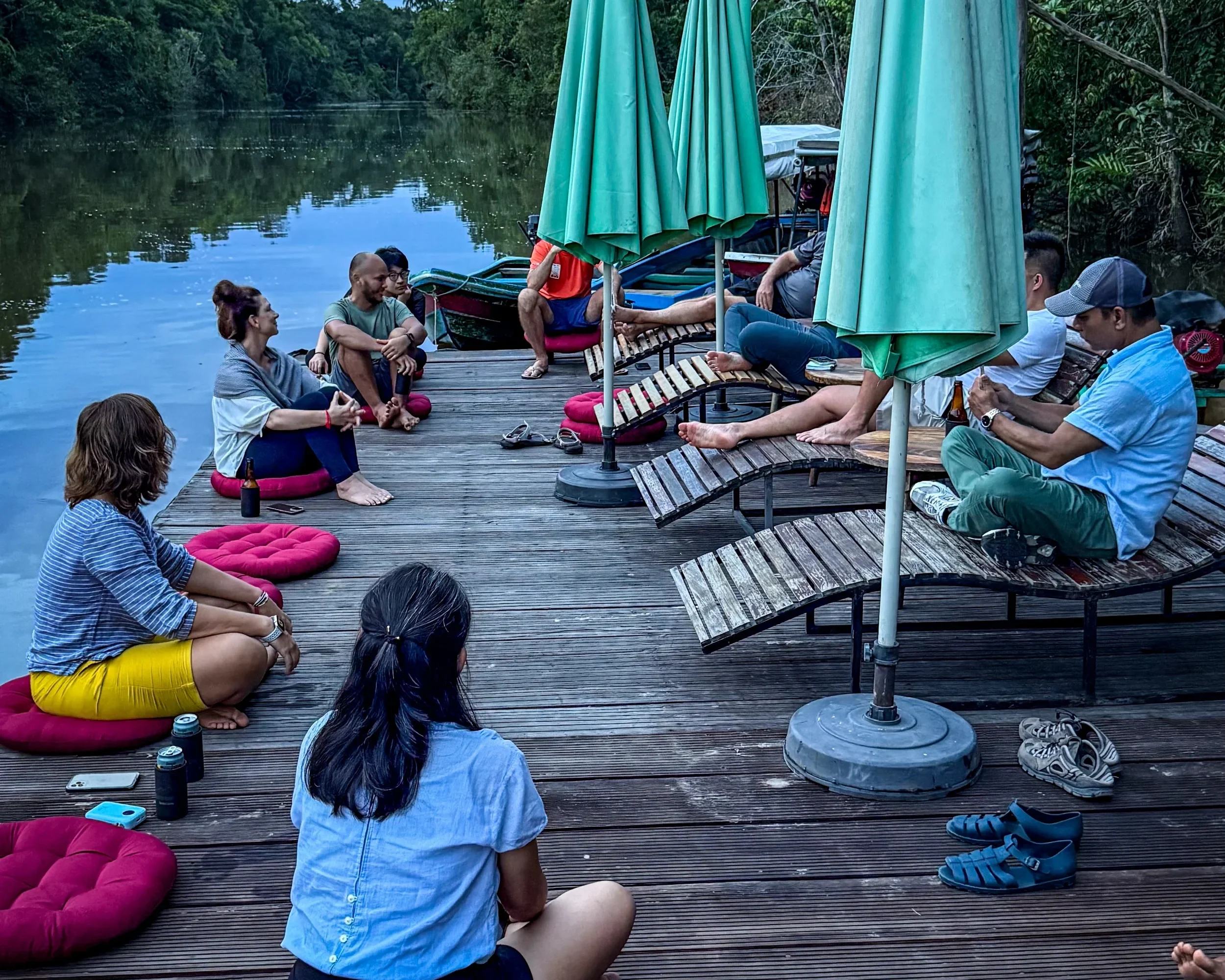 evening-dock-lounge-river-umbrellas.webp