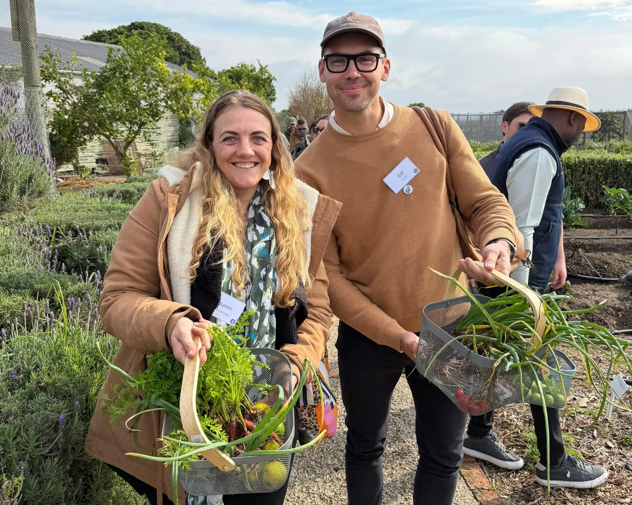 Lauren and Ed filling their baskets with organic produce