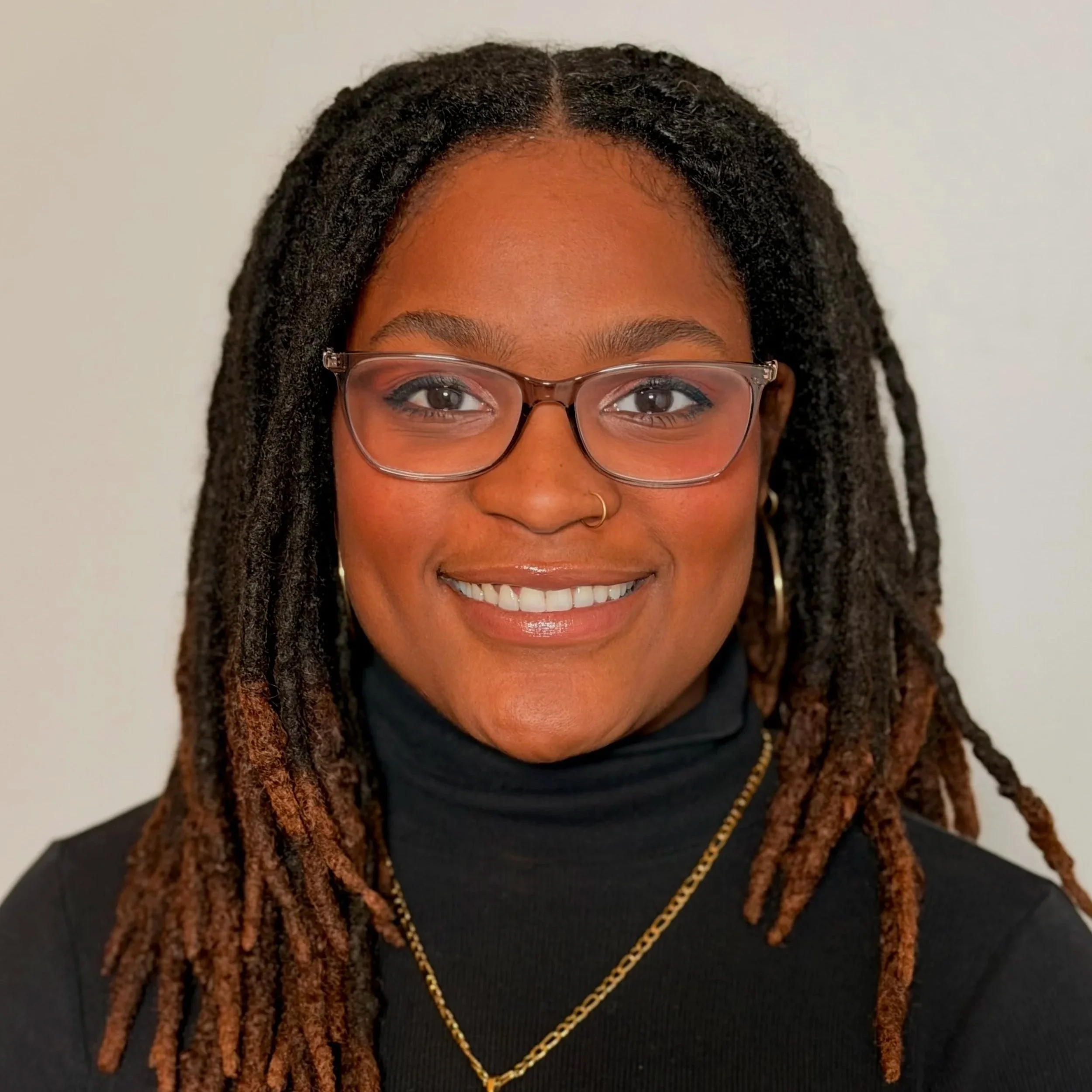 a woman smiling at the camera