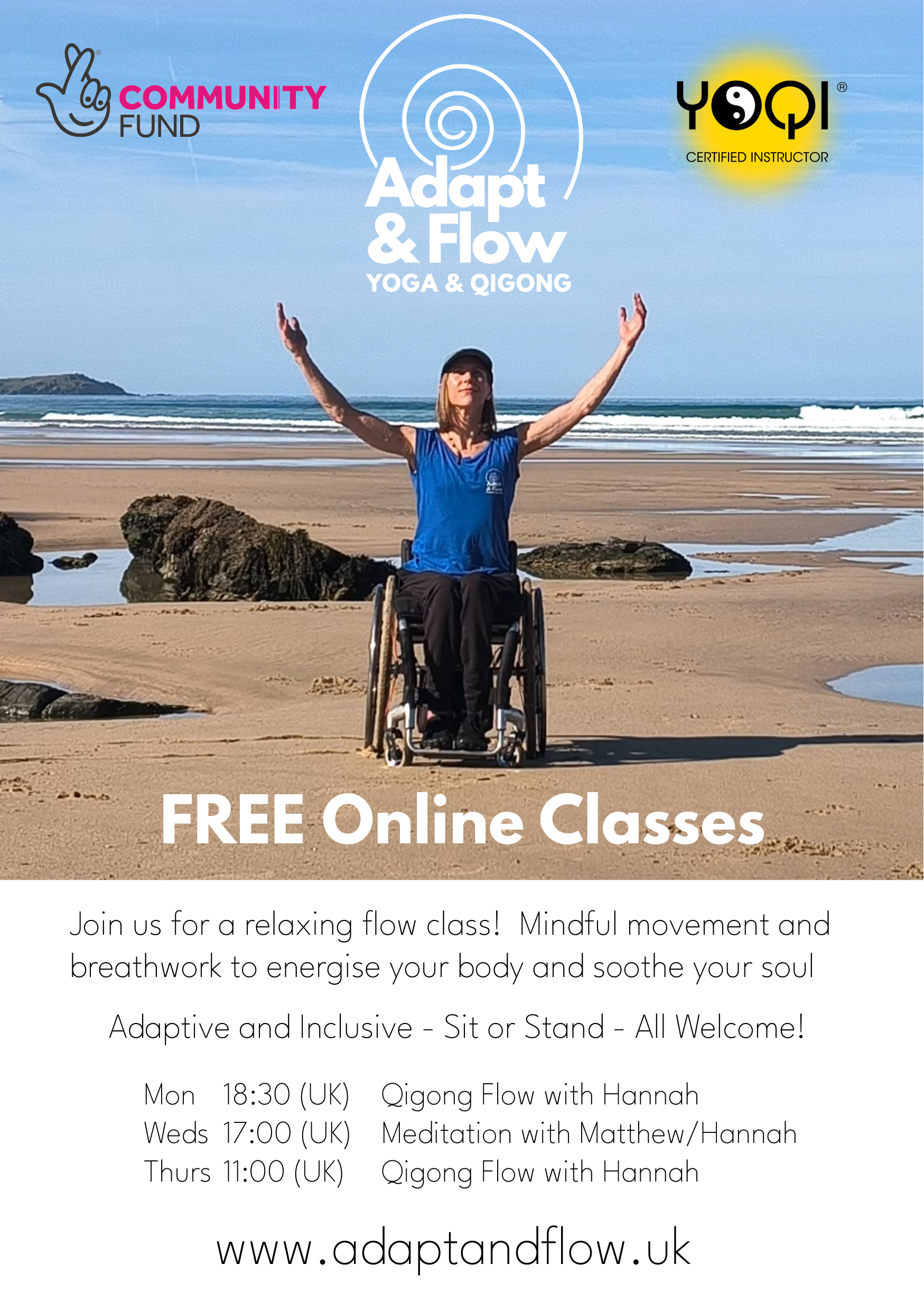 A woman in a wheelchair is practicing Qigong on the beach.  She is wearing a blue t shirt, black pants and a blue cap and has her arms up in the air.  The waves break behind her and there are rocks and rock pools on the beach.