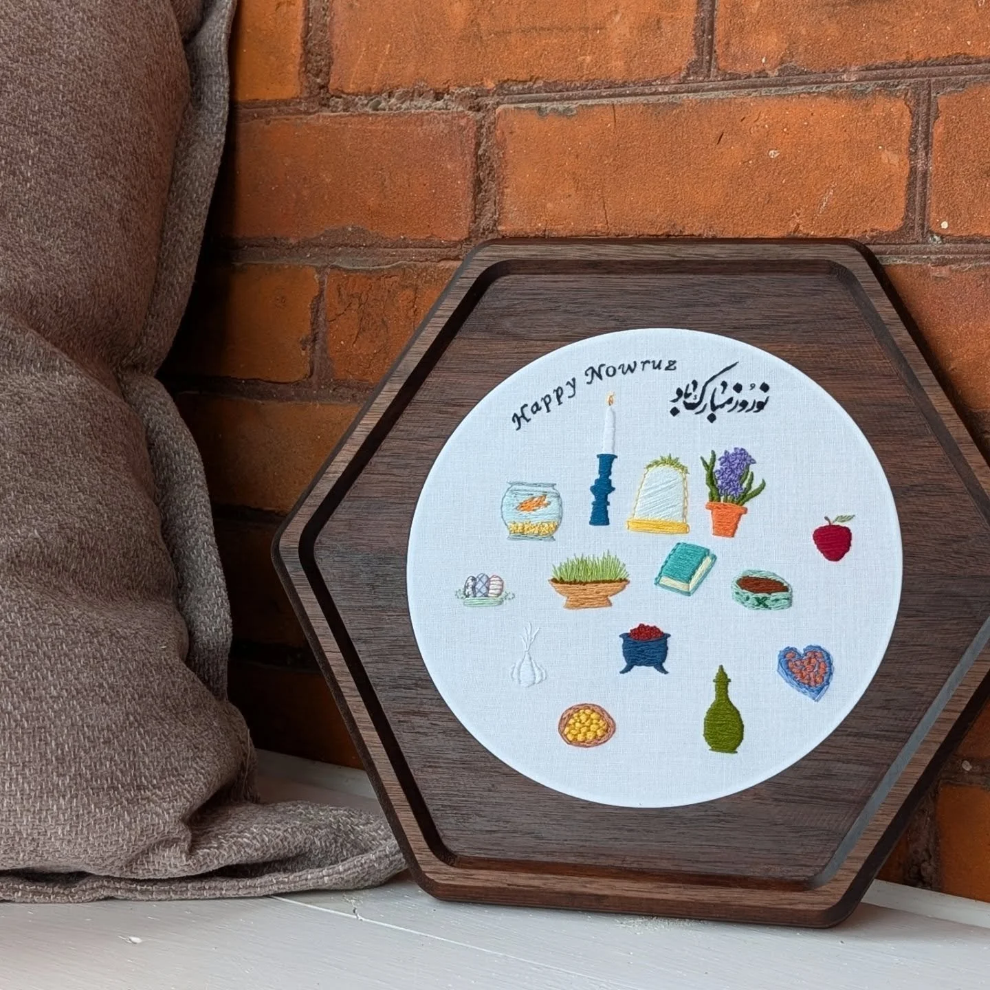 Welcoming the arrival of Spring with the Haft Seen 🪻🪞
This custom walnut frame houses a hand-embroidered display created to honor the beautiful traditions of Nowruz.

My first experience with Nowruz was celebrating with an Iranian friend and her fa