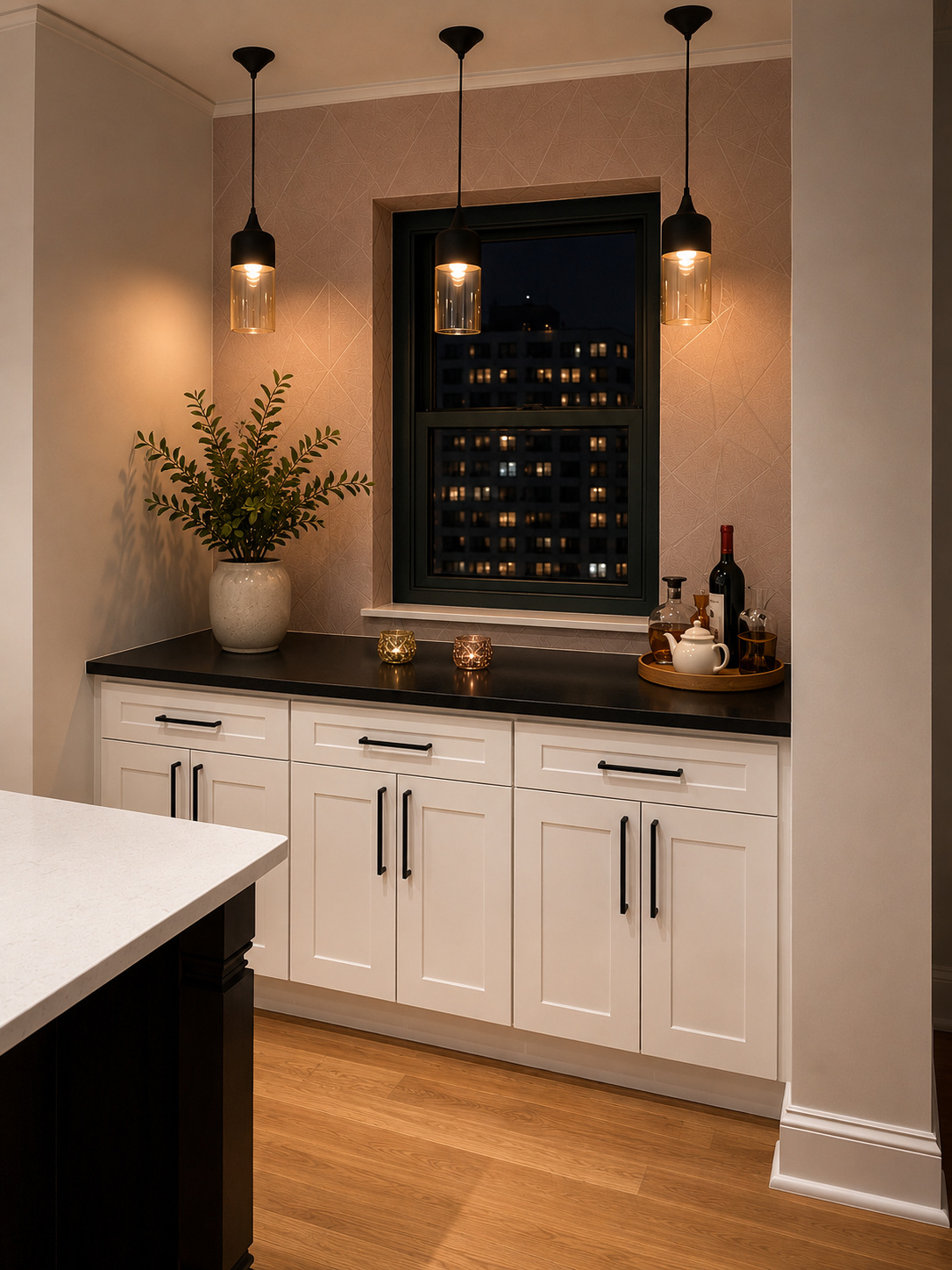 This Brooklyn kitchen renovation features a custom white shaker kitchen, oversized waterfall island, integrated cooktop, black steel range hood, and warm oak flooring. Designed by From David Designs, the space balances timeless materials with modern 