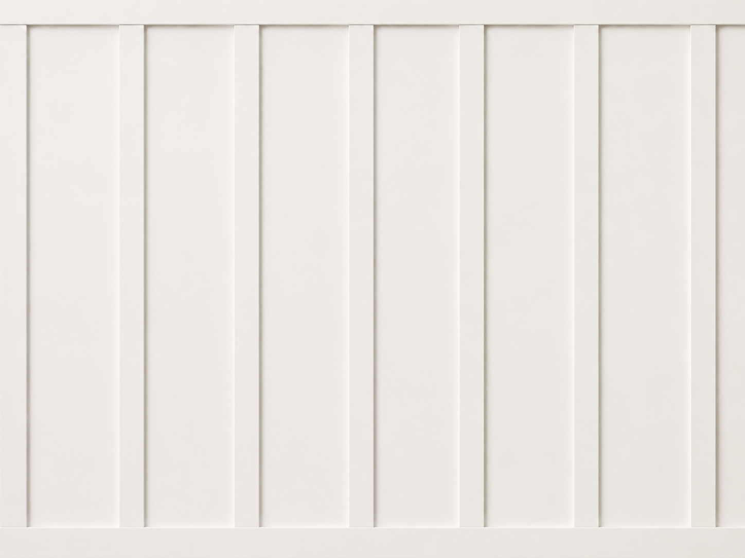 This residential staircase renovation features custom white oak treads, a matching handrail, black metal balusters, and full-height board and batten wall paneling. Designed by From David Designs, the staircase serves as a central architectural featur