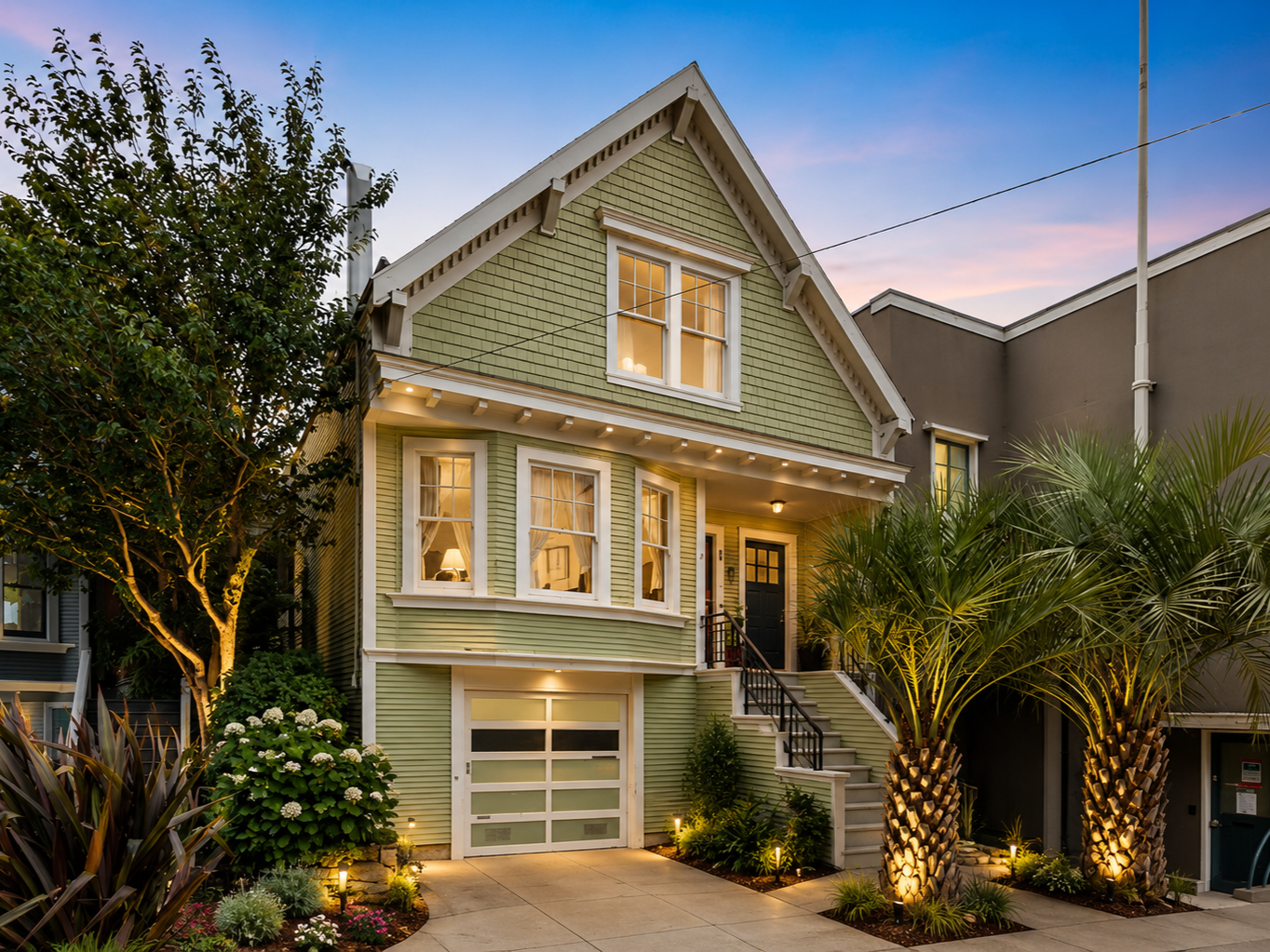 This San Francisco Victorian renovation revitalizes a historic residence through exterior restoration, updated landscaping, architectural lighting, and thoughtful preservation of original character. Custom detailing, lush planting, and warm exterior 