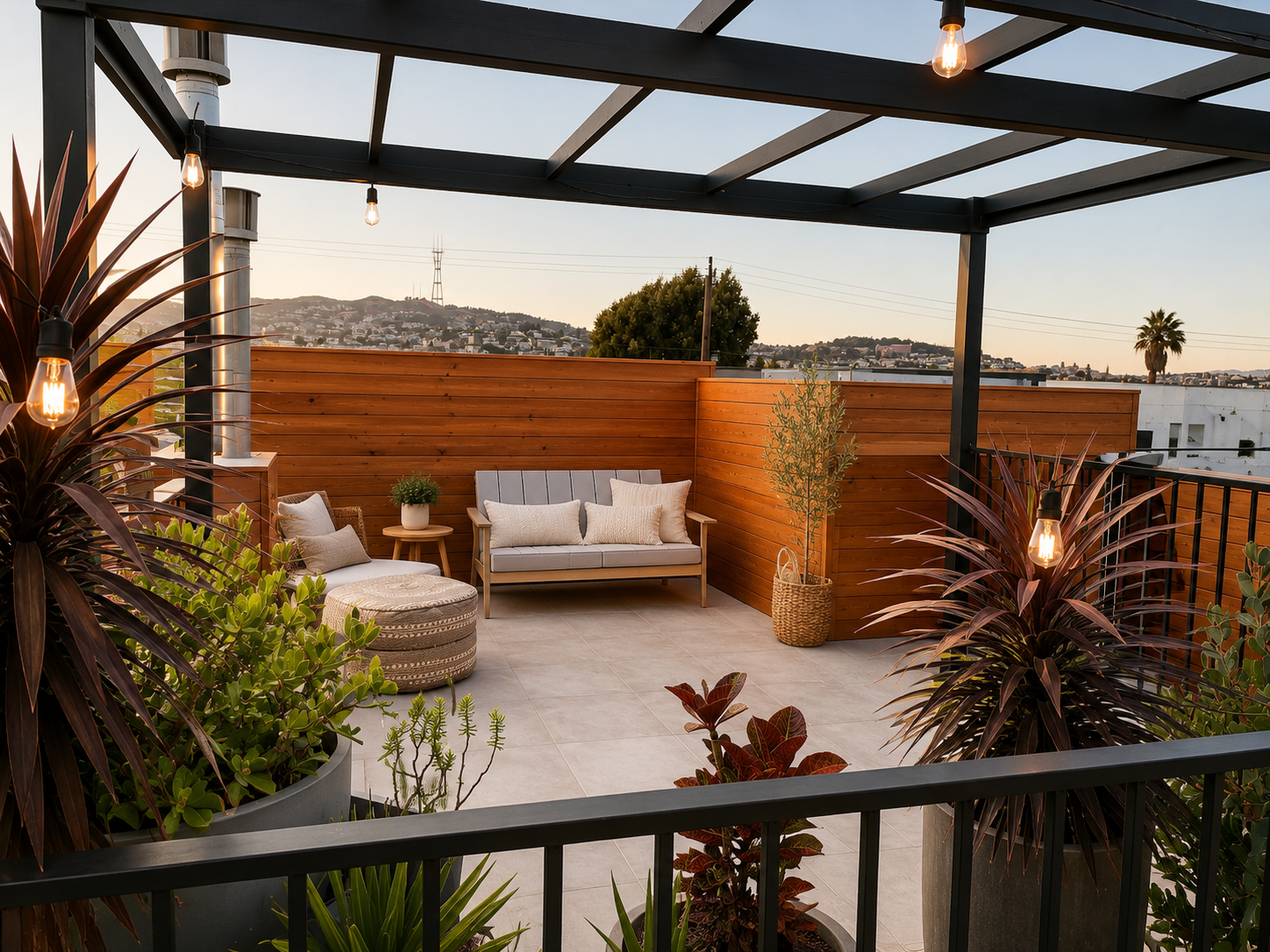 This San Francisco roof deck design transforms an outdoor terrace into a warm, livable extension of the home. A black pergola, wood privacy fencing, layered planters, string lights, and relaxed lounge seating create a comfortable outdoor space with v