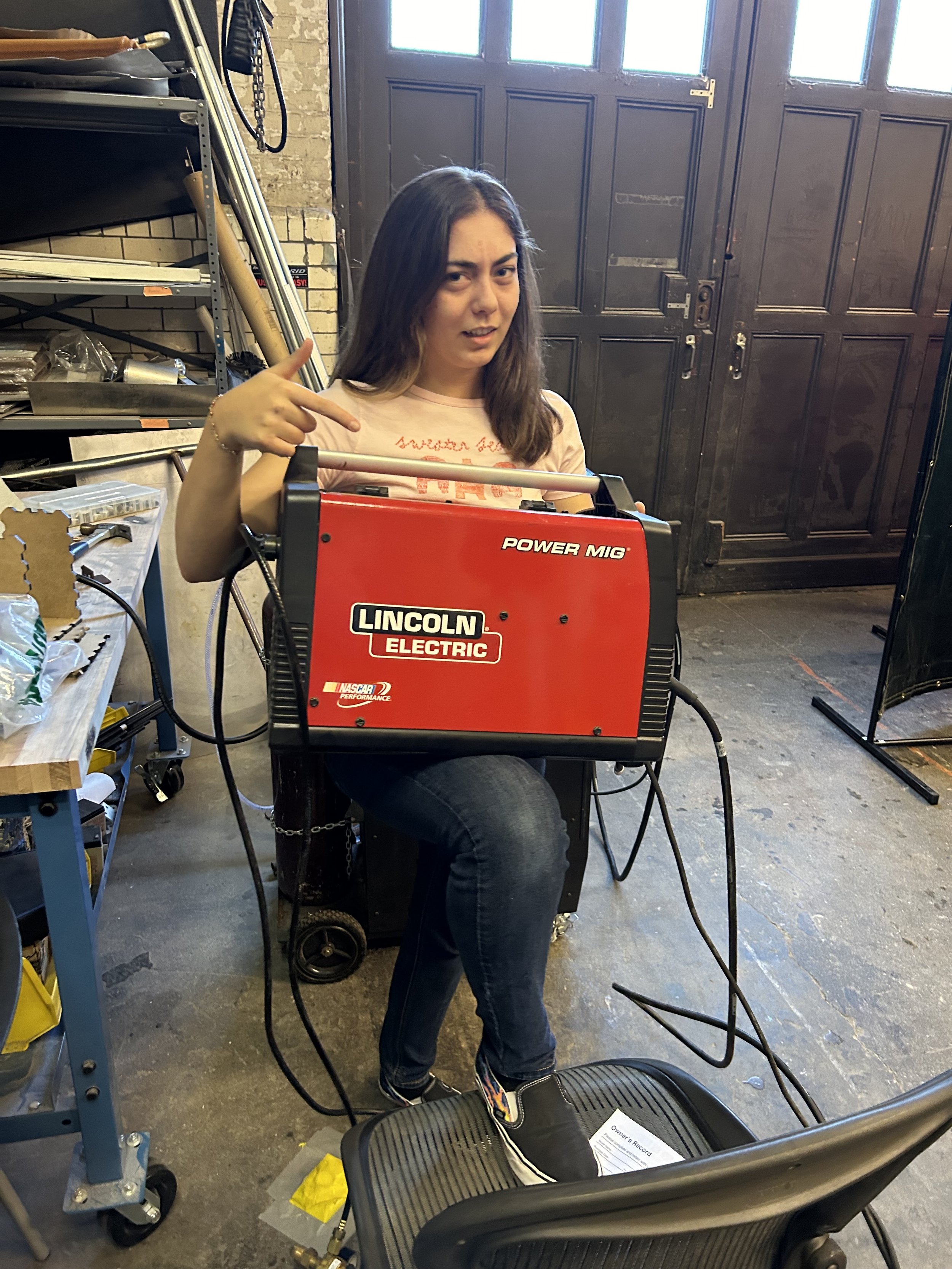 Fun picture of me hold our old TIG welding machine