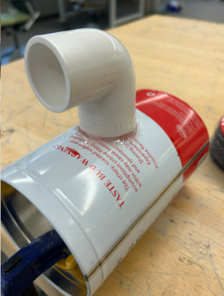 Attaching an elbow pipe to the can using epoxy