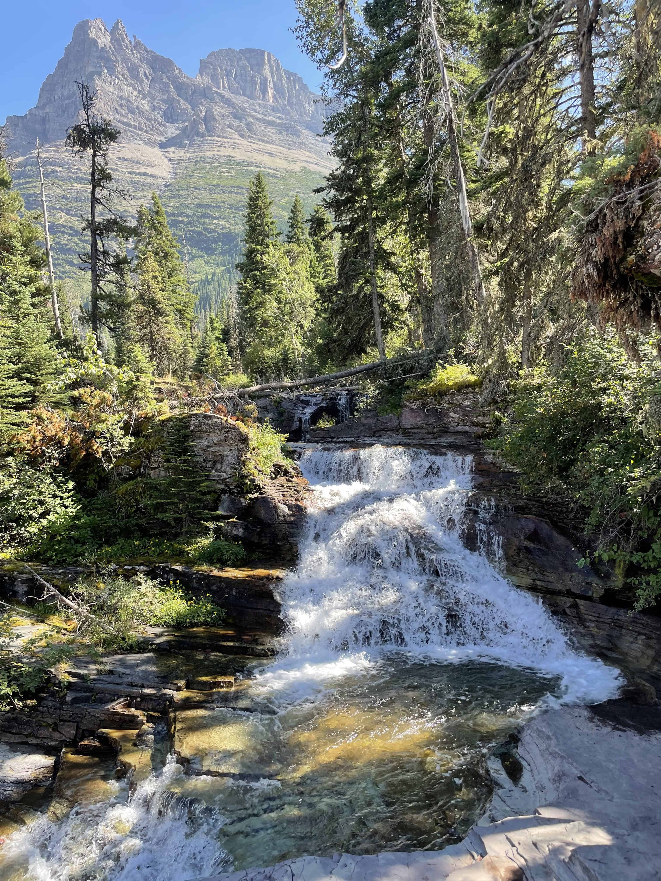 Mountain waterfall in Glacier National Park visited during retreat