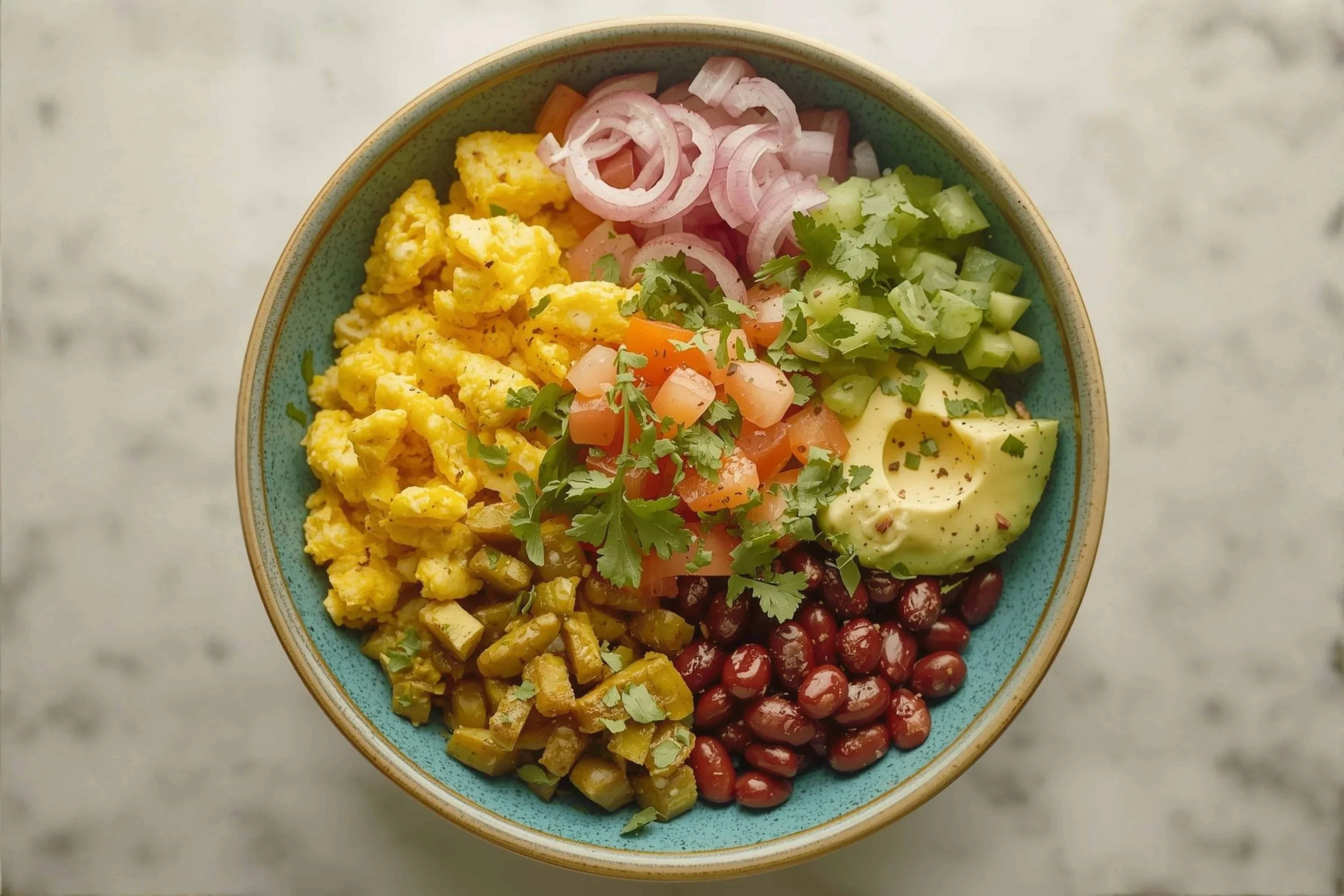 balanced breakfast bowl with plantains, eggs, beans, and avocado for a wellness retreat