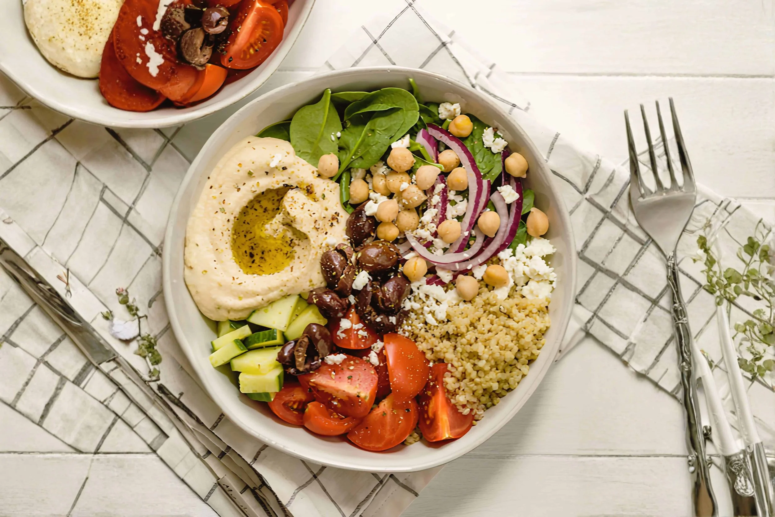 greek quinoa bowl with fresh vegetables as a nourishing retreat lunch