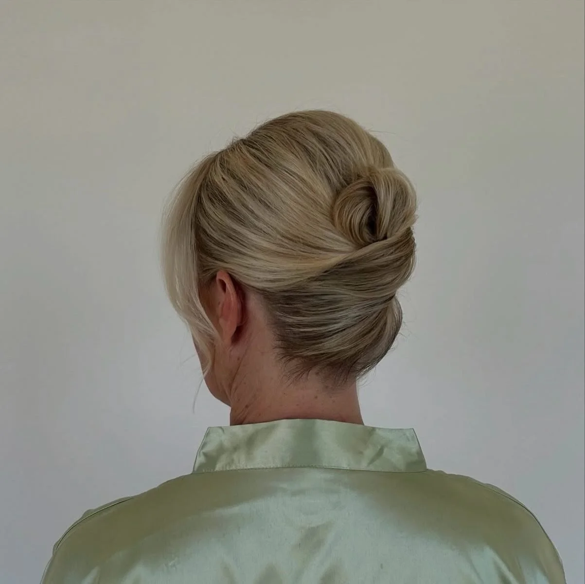 A timeless updo never goes out of style.

Soft, polished, and effortlessly elegant, this bridal style was designed to feel classic from every angle. We love how the clean lines and delicate face-framing pieces create the perfect balance of sophistica