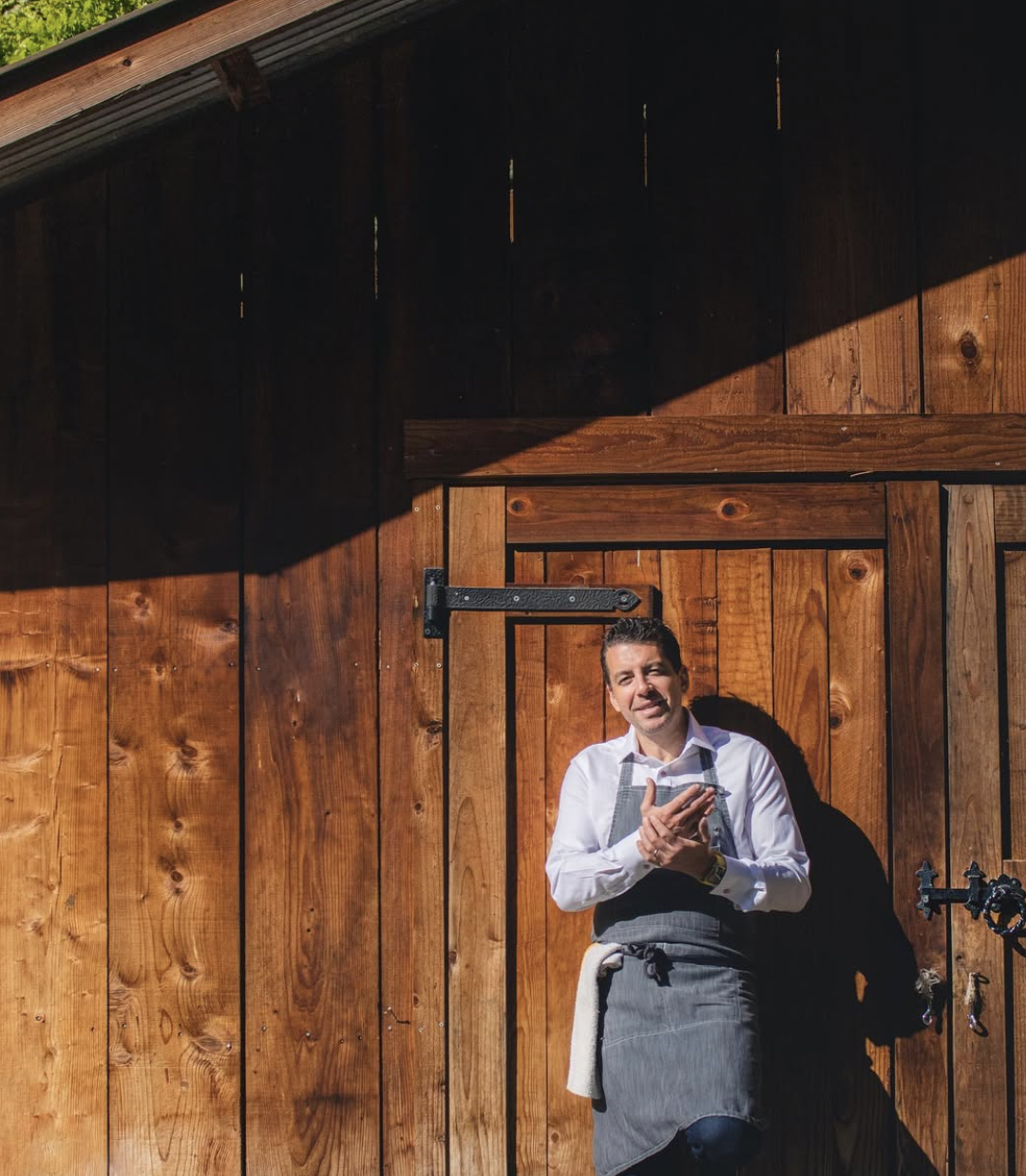 Chef Ari in front of a barn.