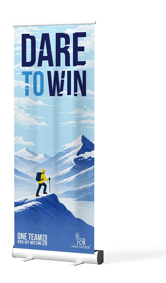 Branded roller banner for Novo Nordisk's Dare to Win team kick-off meeting, featuring alpine illustration and event identity designed by 6 Egg Design