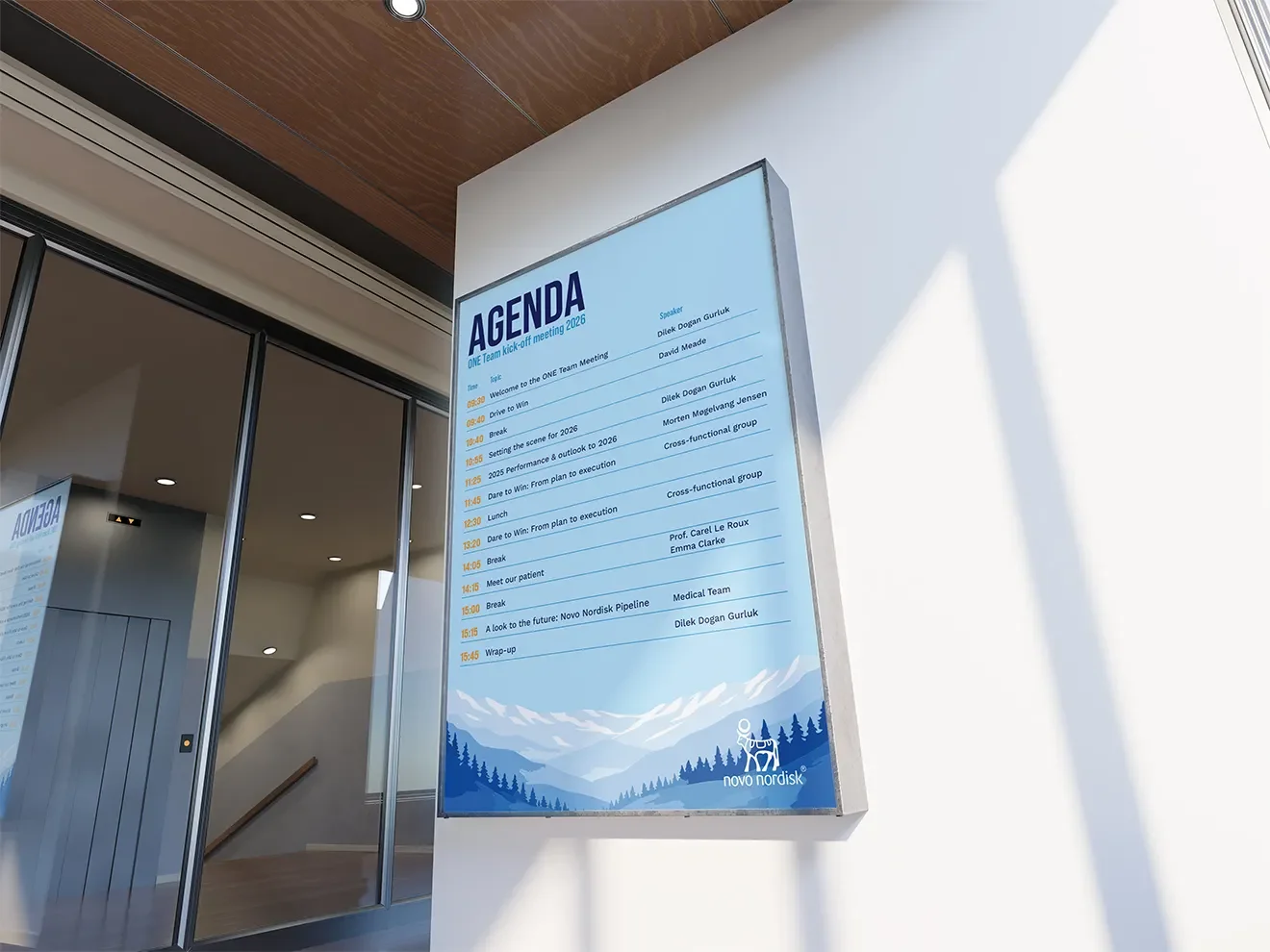 Framed event agenda display installed at the Novo Nordisk kick-off meeting venue at Croke Park, Dublin, showing branded layout and alpine design system