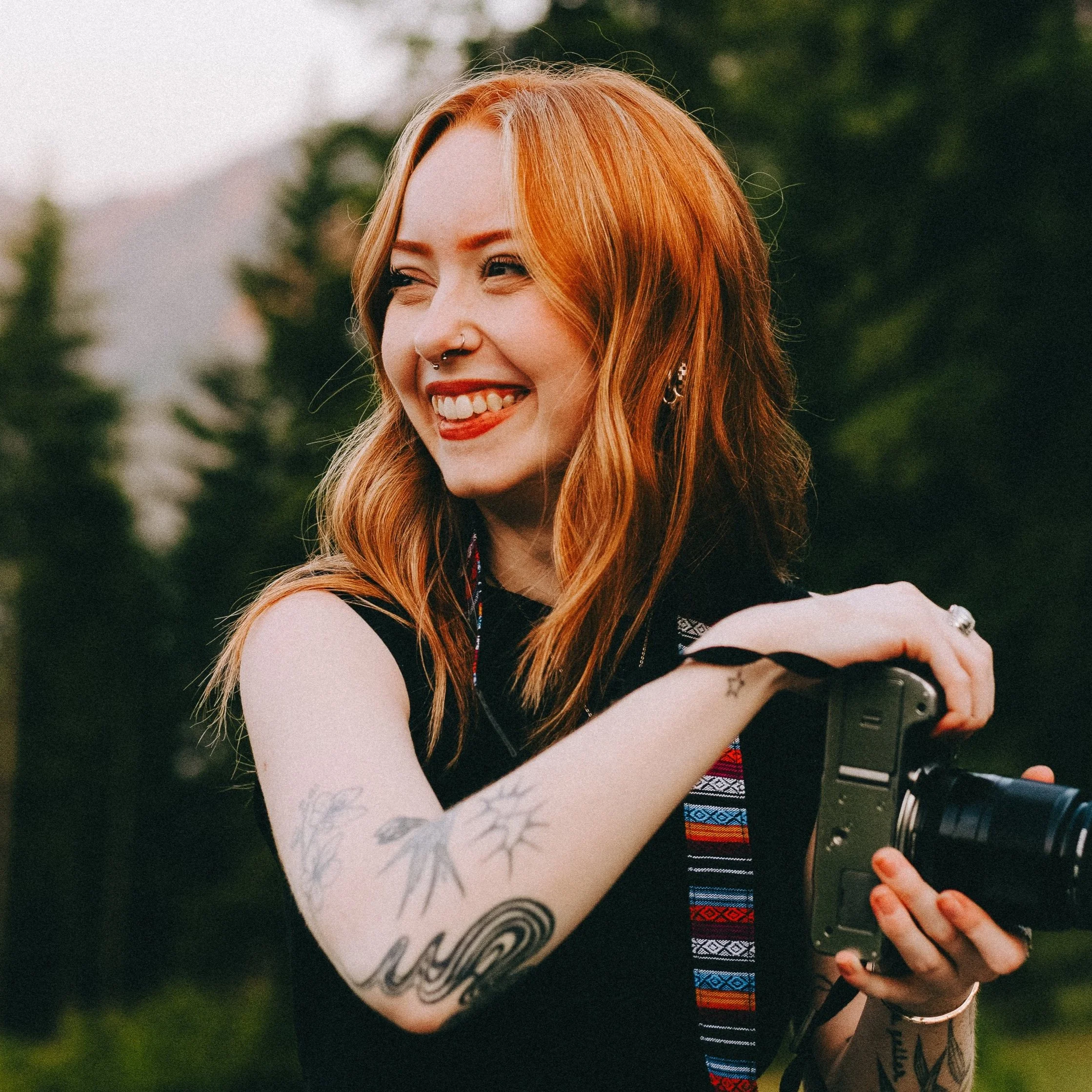 Katherine Vandergriff of Katsphilm holding a camera outdoors