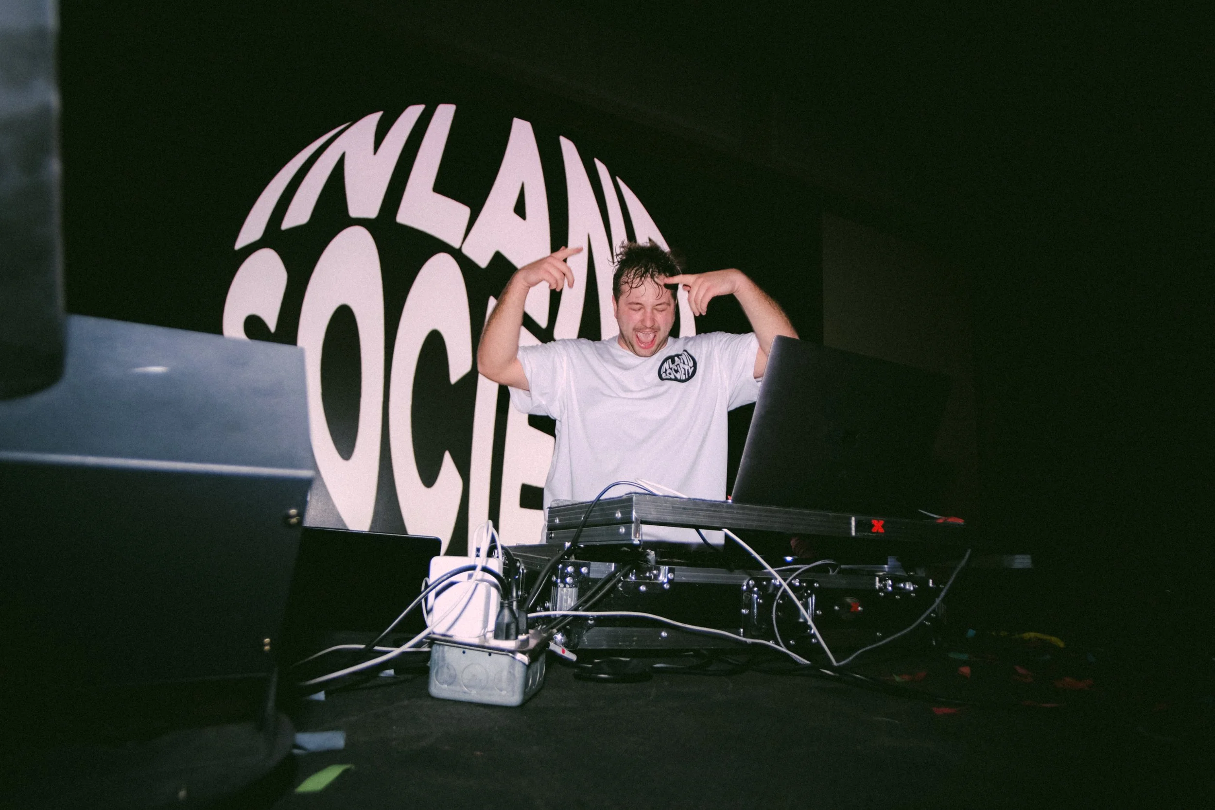 DJ performing at a live music event photographed in Albuquerque, New Mexico.