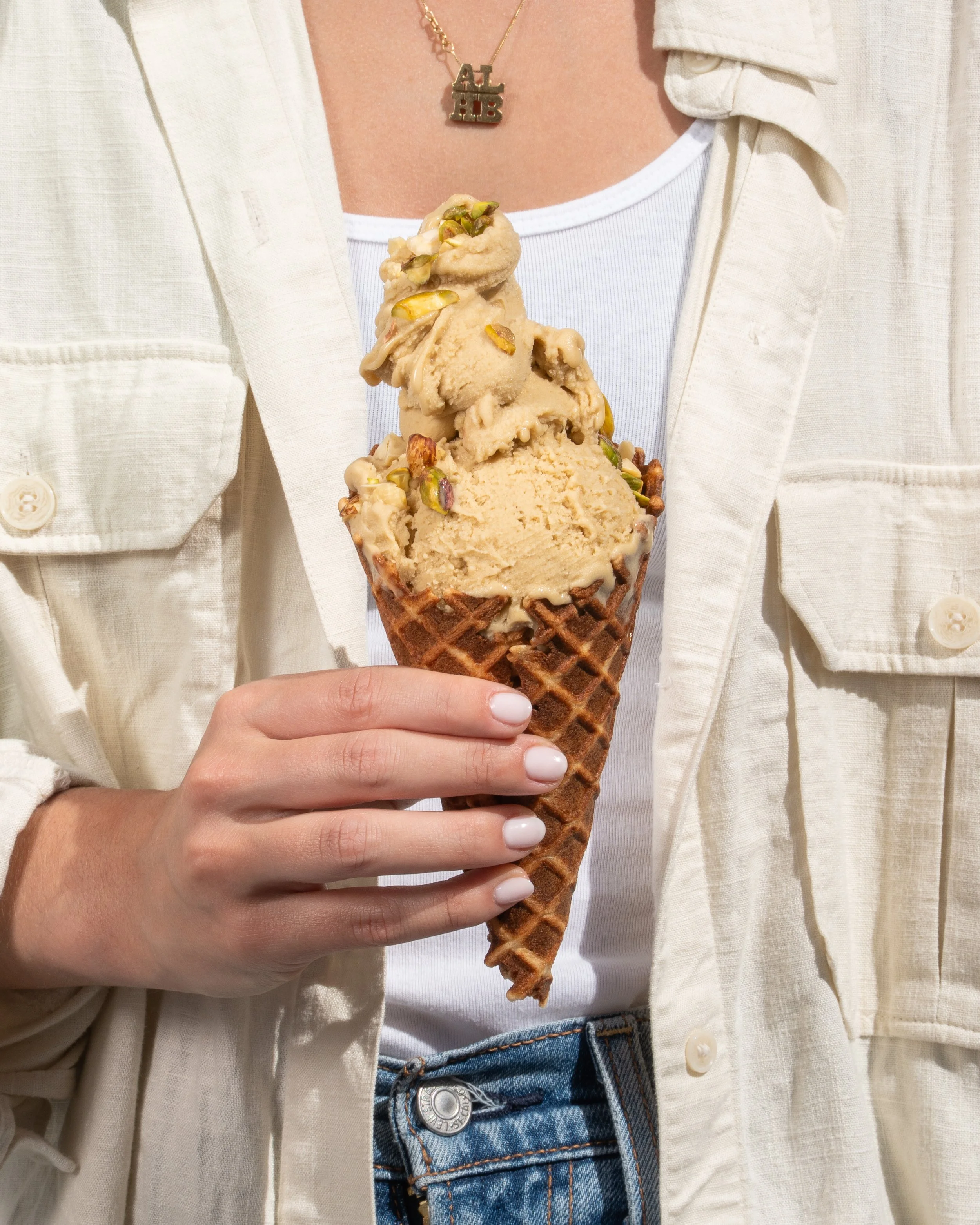 pistachio gelato in a cone