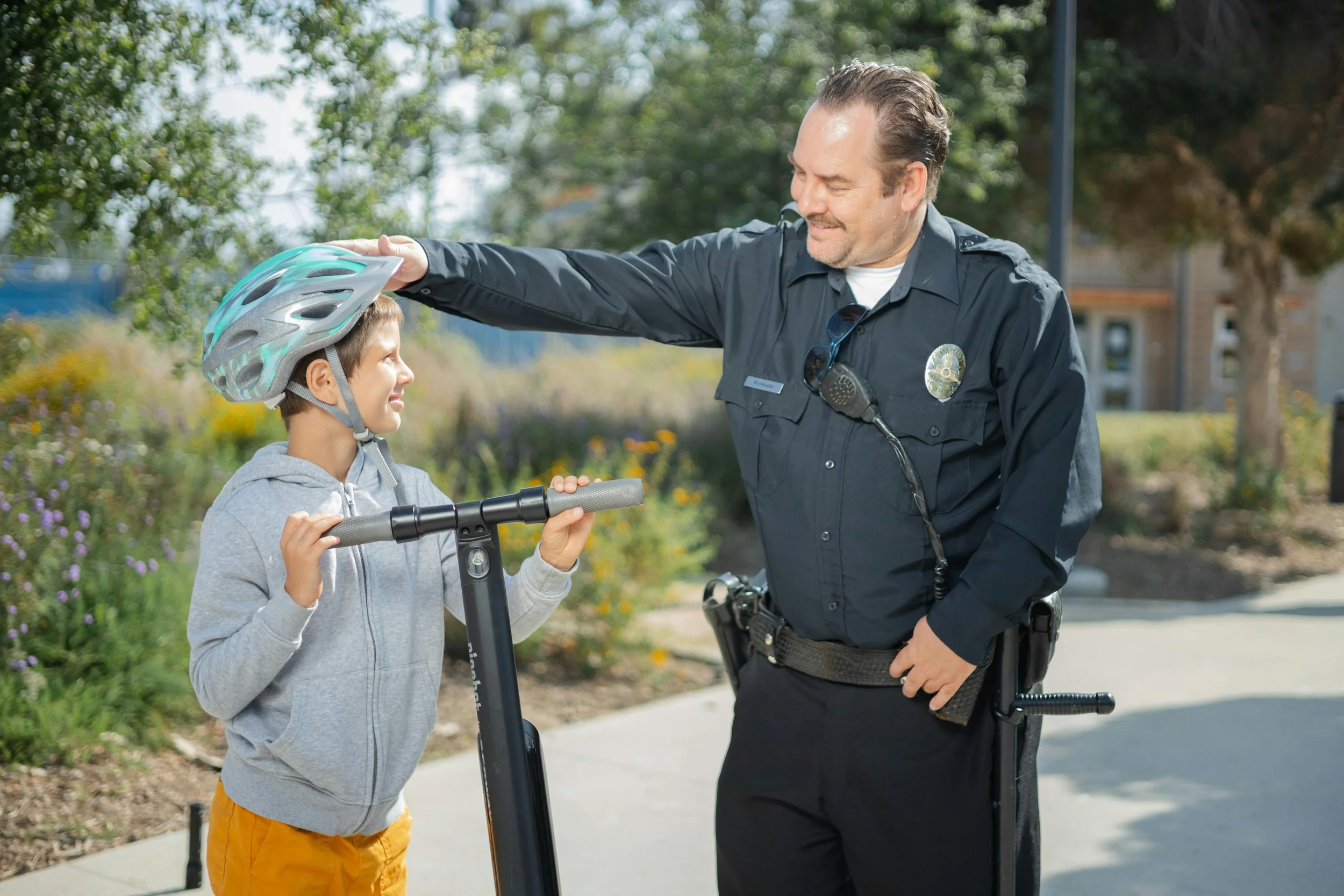 boy saying hello to police officer.jpg