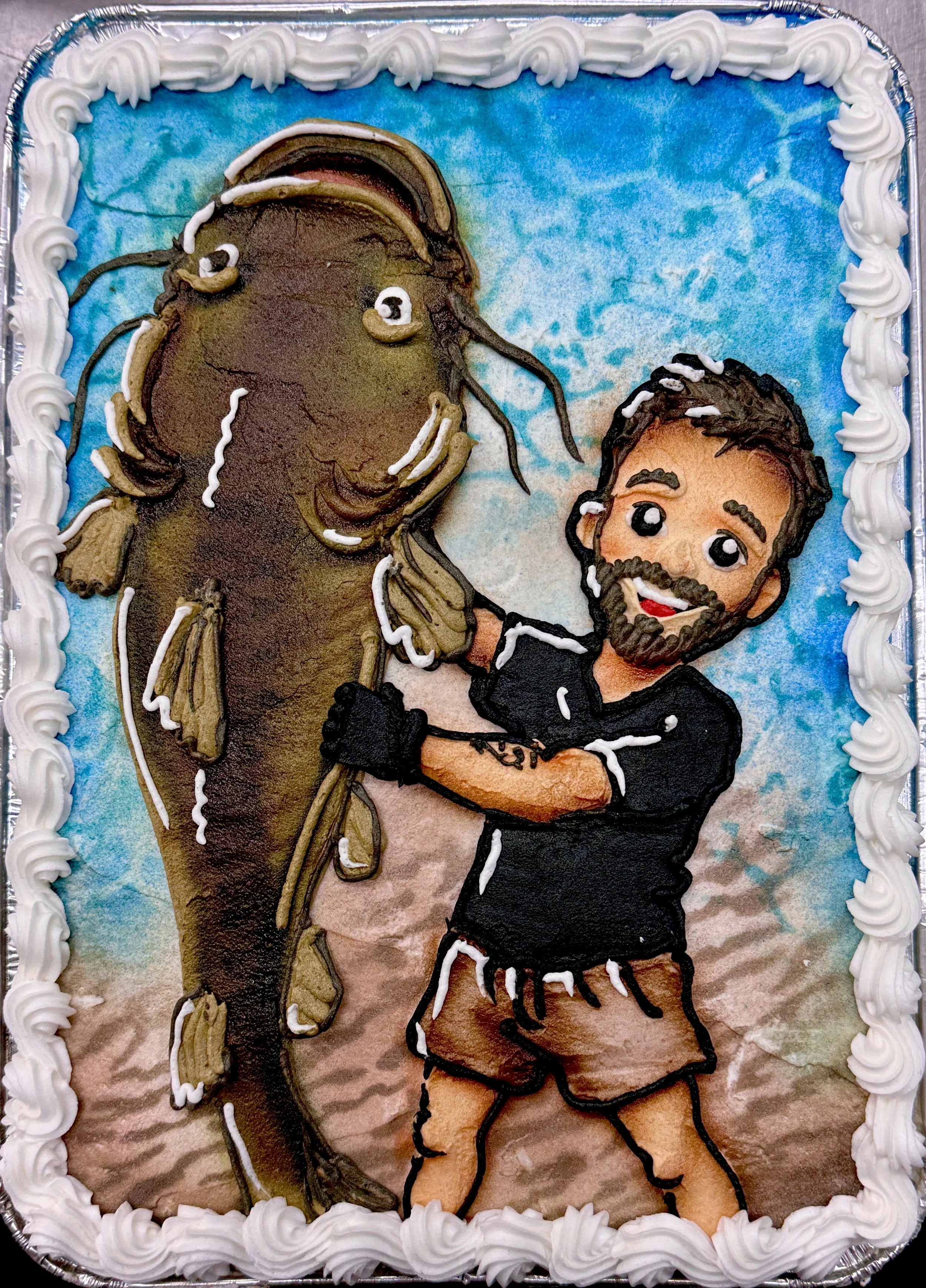 A birthday cake decorated with an image of a man and a horse, both made of colored icing, with white piping along the edges and a blue sky background.