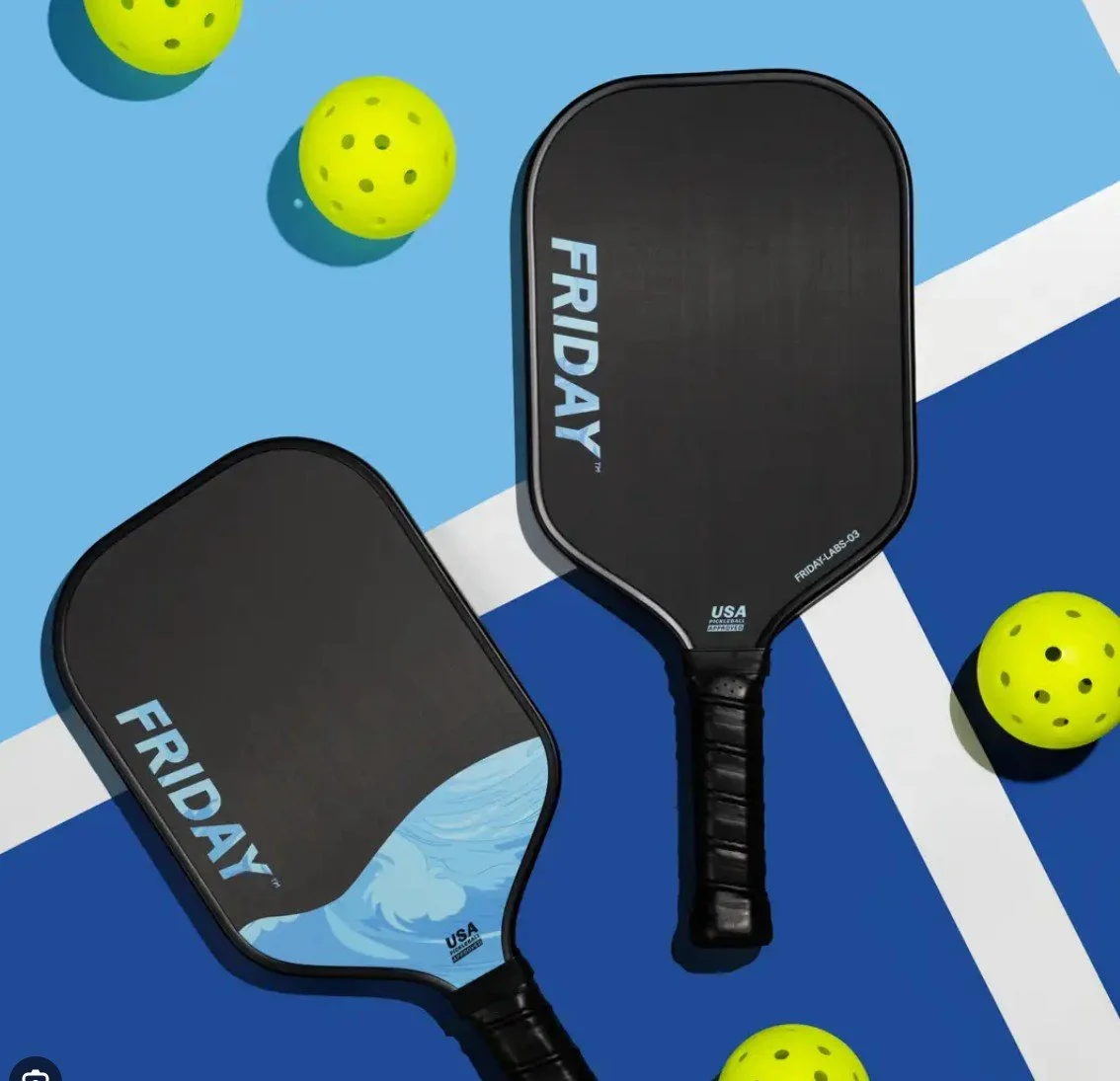 A black pickleball paddle with a colorful digital design on its face, featuring the brand name JOOLA and the word STRATOS.