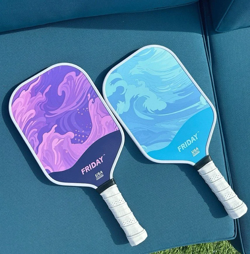 Black pickleball paddle with white and silver branding and a brown grip, labeled SLK by Selkirk, designed for USA pickleball competitions.