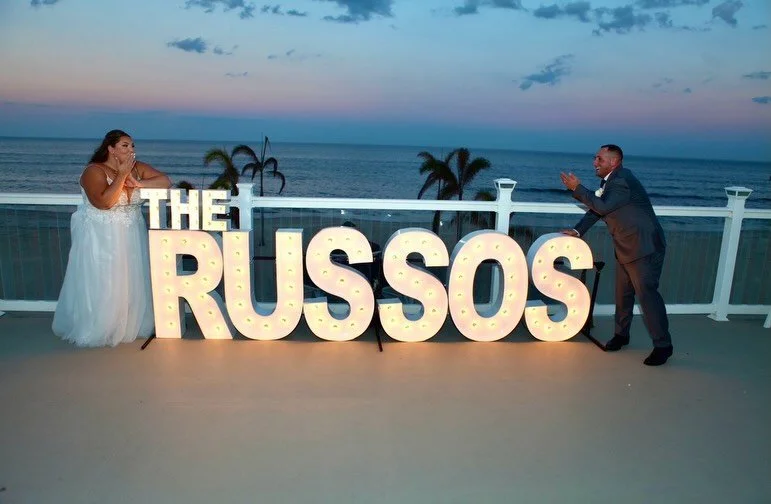 We loved bringing this wedding to life through paper and thoughtful details inspired by their seaside venue, Windows on the Water.

We created a soft pale blue and ivory tri-fold invitation featuring a custom illustration of the venue- a design that 