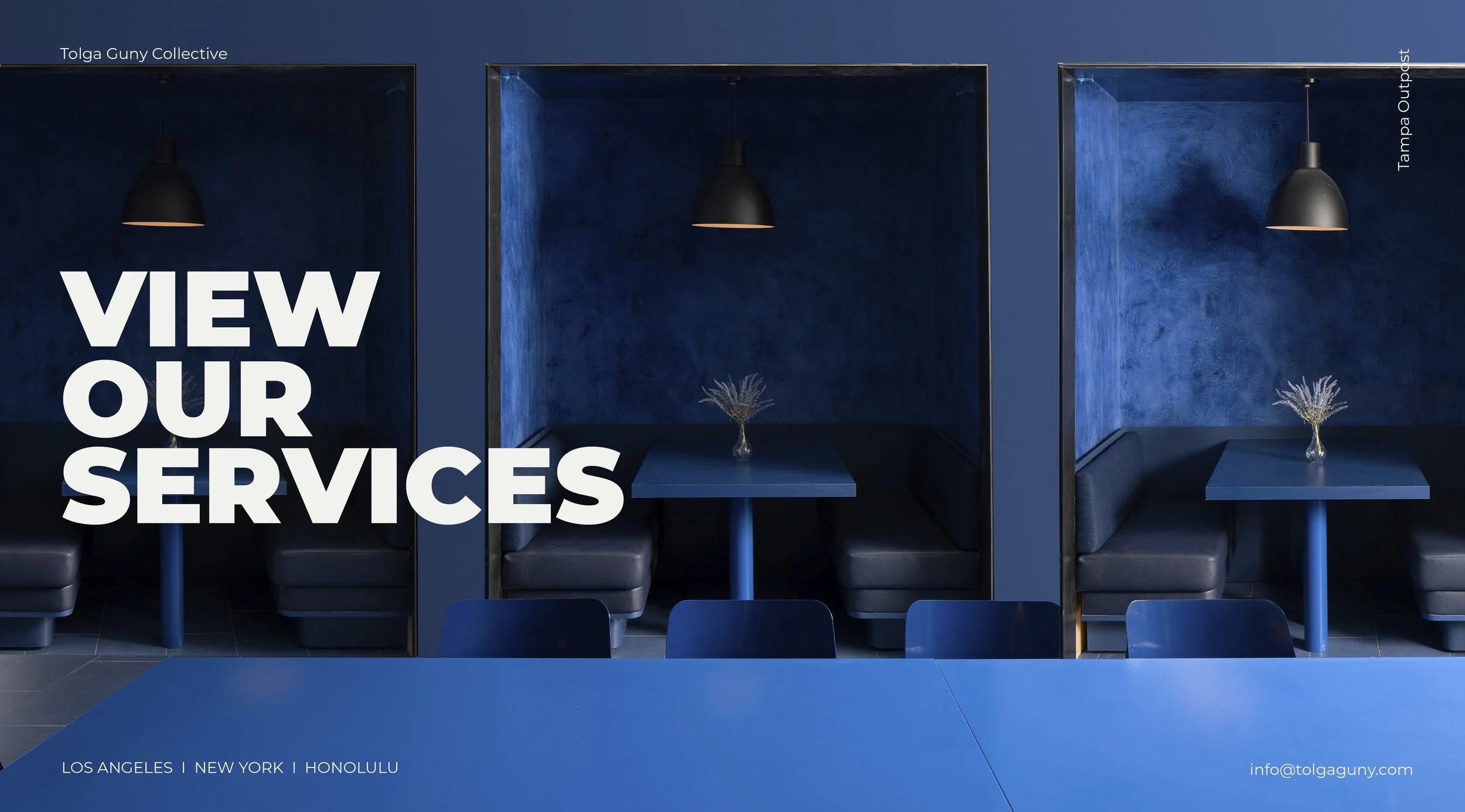 Interior of a modern restaurant booth with dark blue walls and matching seating, a brick of three booths, each with a small table and a vase with dried flowers, black pendant lights hanging above, large bold white text says "View Our Services", locations listed as Los Angeles, New York, Honolulu, and contact email info@tolgaguny.com.