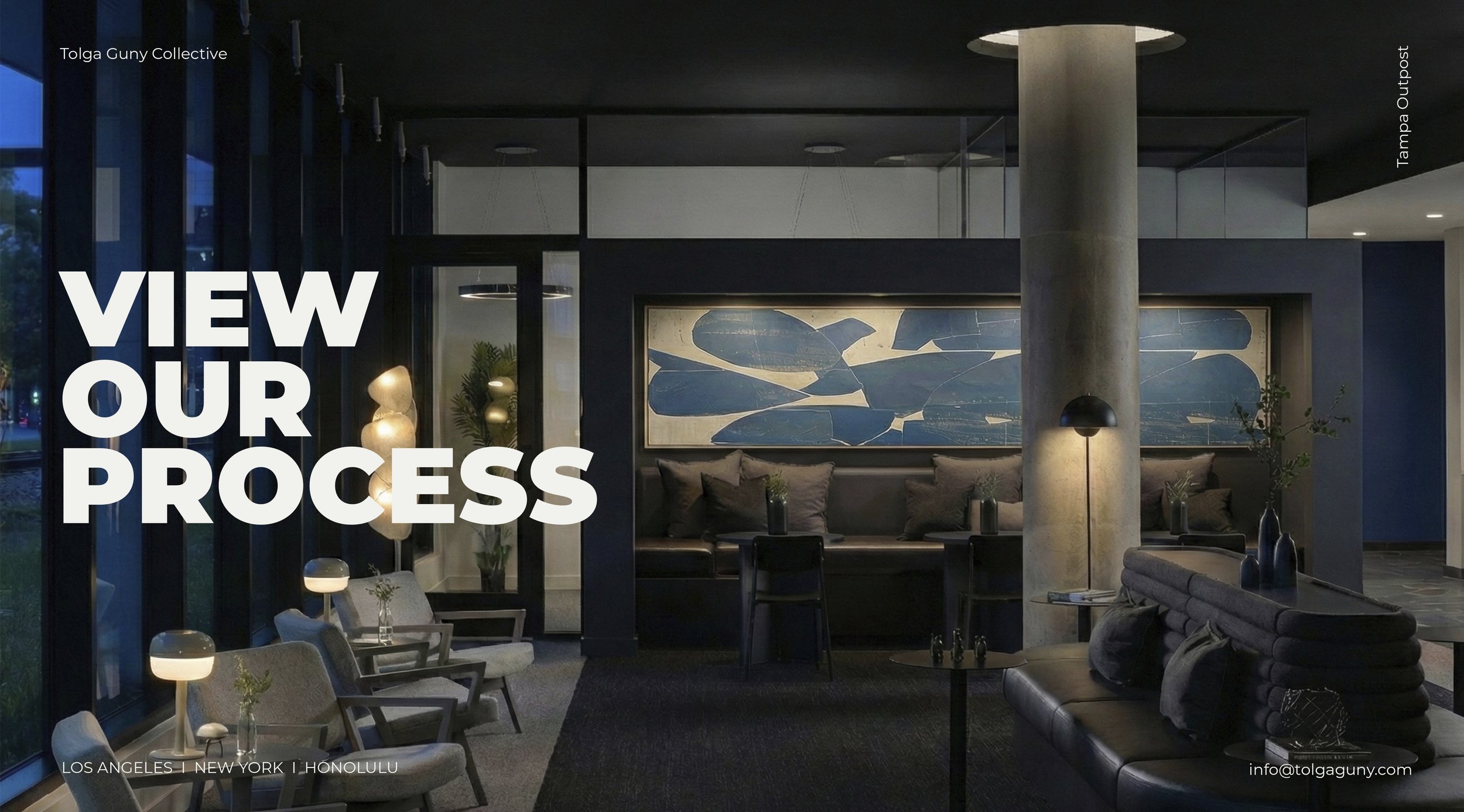 Modern interior lobby with seating area, decorative lighting, abstract wall art, and large windows showing outdoor greenery.