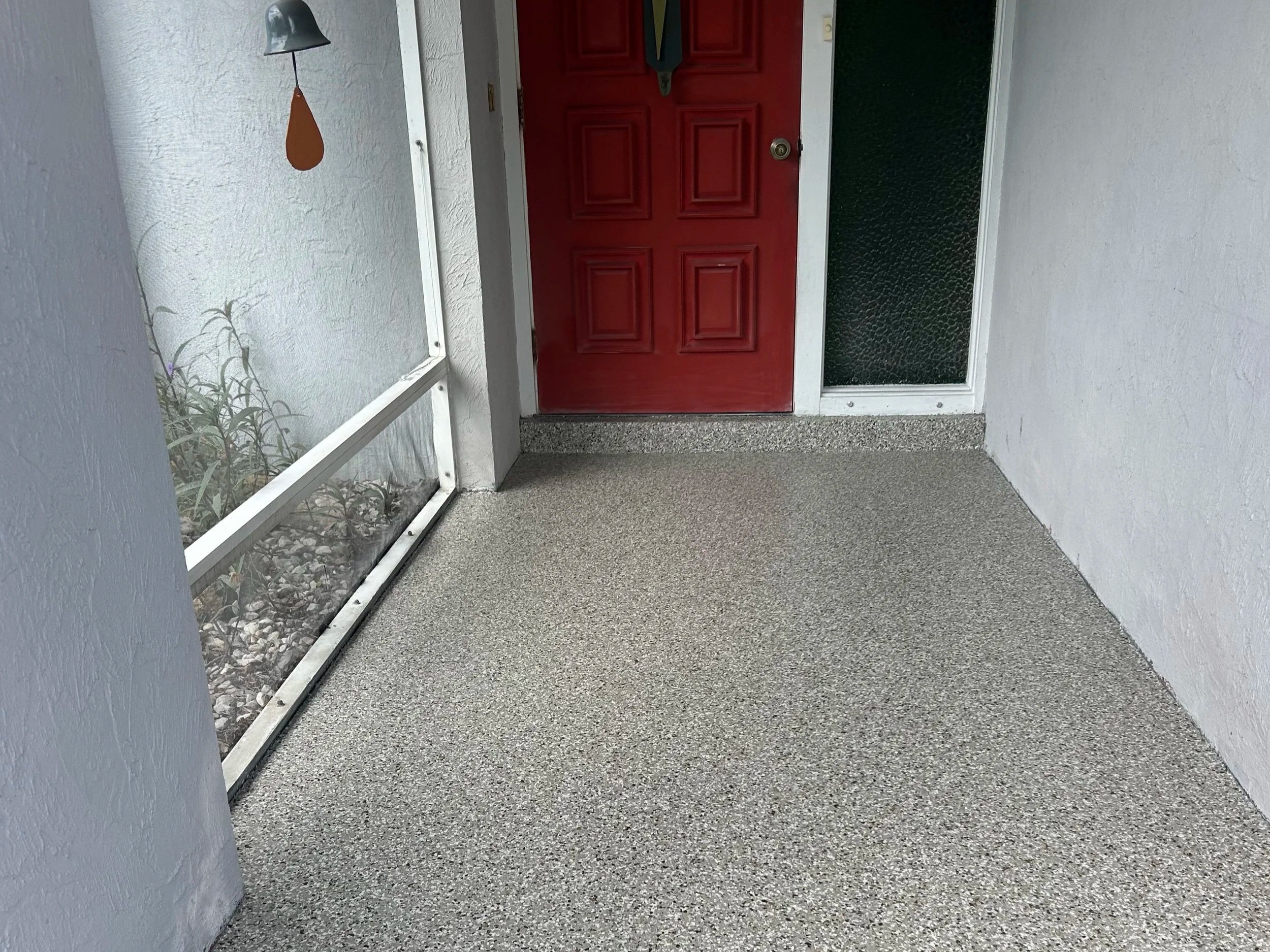 Professional polyaspartic coating on residential entryway in Englewood FL