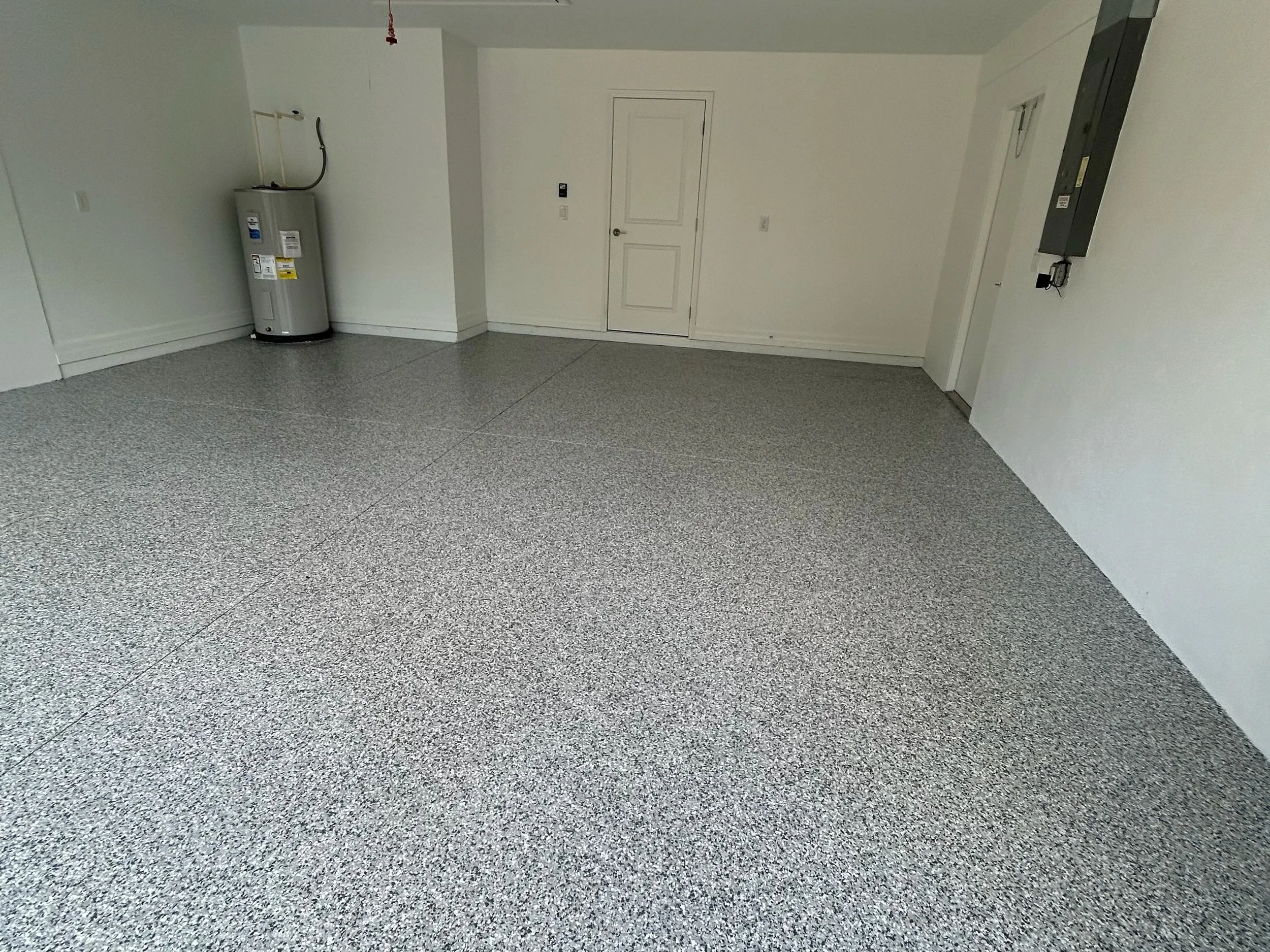 Finished garage floor epoxy flake coating completed in Englewood FL